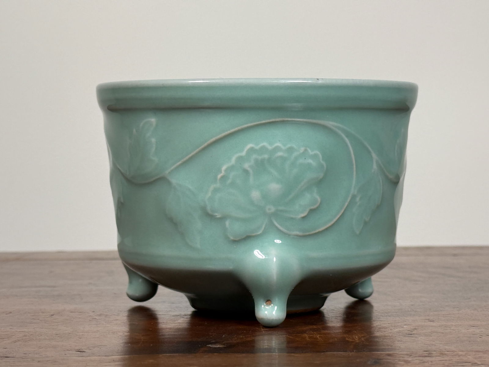 JAPANESE CELADON PORCELAIN CENSER WITH LOTUS: Japanese celadon porcelain censer with raised lotus design. Dimensions: Diameter: 4.5 in. Height: 3.25 in. Note: This item is in New York, where it can be shipped from.