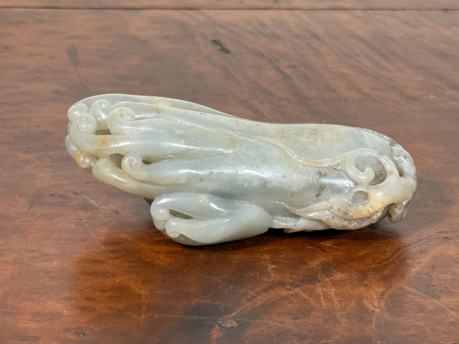 CHINESE JADE CARVING OF BUDDHA HAND FRUIT: Chinese jade carving of Buddha Hand fruit (fingered citron). Dimensions: Length: 4.25 in. Note: This item is in New York, where it can be shipped from.