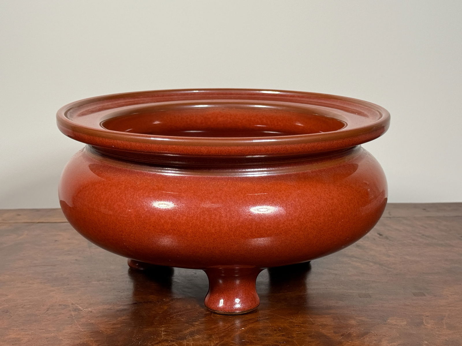 CHINESE IRON RUST GLAZED TRIPOD PORCELAIN CENSER: Chinese monochrome porcelain censer of iron rust glaze, with impressed mark. Dimensions: Diameter: 8.5 in. Height: 4.5 in. Note: This item is in New York, where it can be shipped from.
