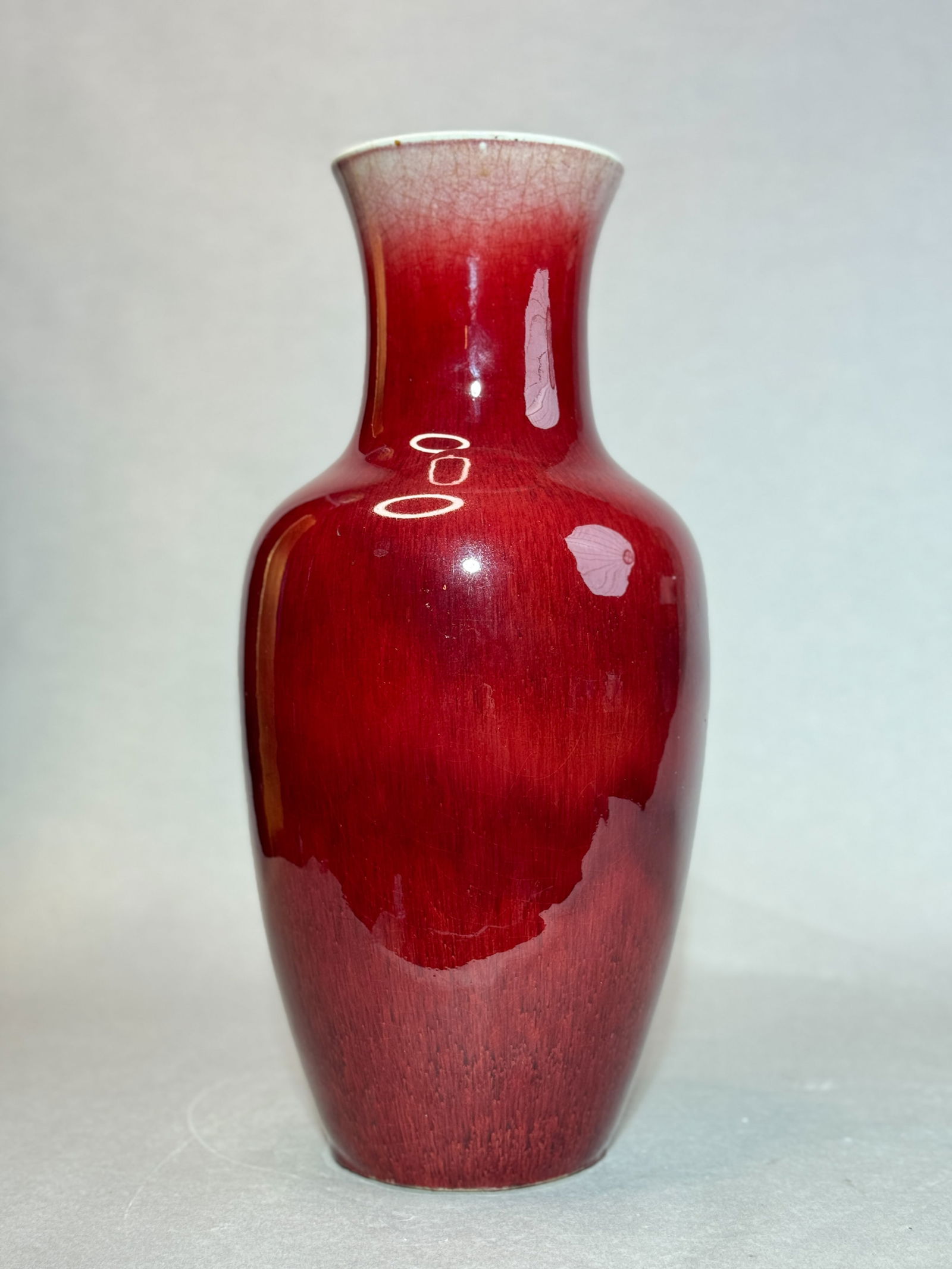 CHINESE LANG KILN OXBLOOD PORCELAIN VASE: Chinese Lang Yao kiln porcelain vase with brilliant red glaze, unmarked. Dimensions: Height: 18 in. Note: This item is in New York, where it can be shipped from.