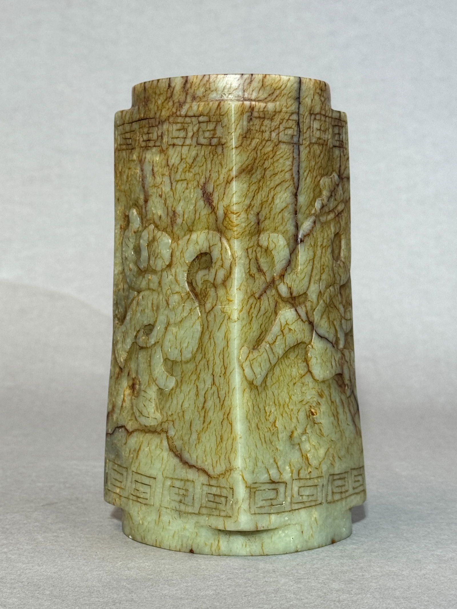 CHINESE ARCHAIC JADE ZHONG: Chinese carved celadon jade Zhong with raised dancer motif. Dimensions: Height: 8 in. Note: This item is in New York, where it can be shipped from.