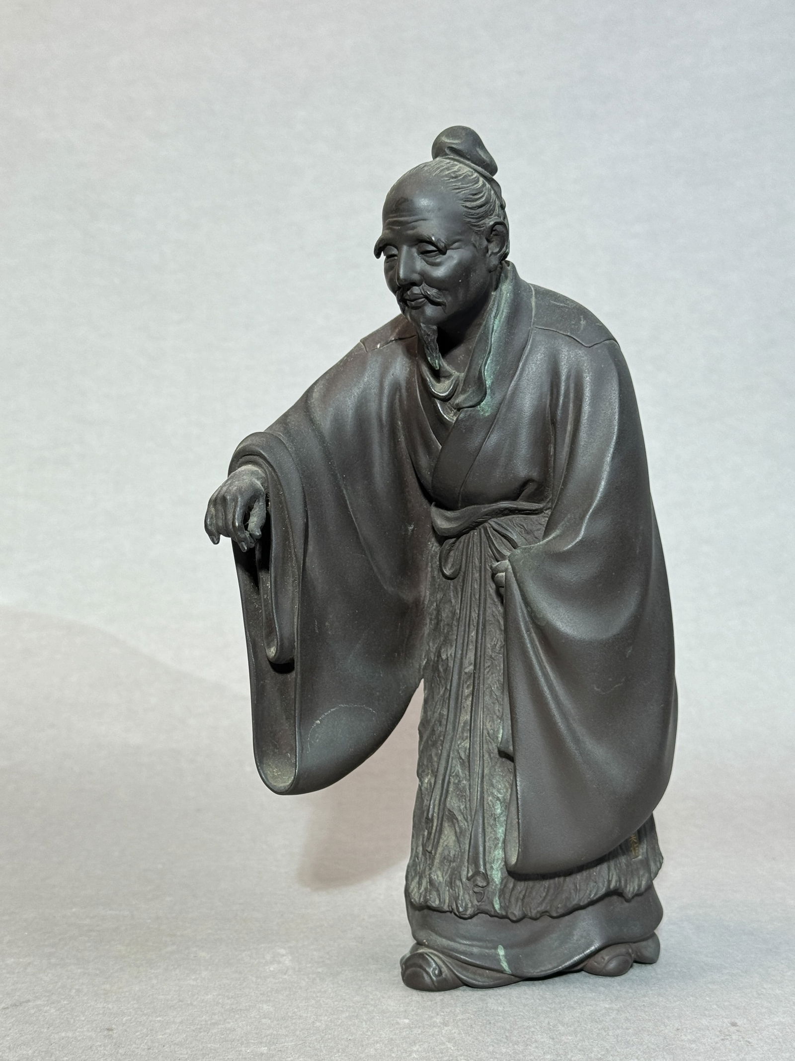 JAPANESE MEIJI BRONZE SCHOLAR WITH GOLD INLAY MARK: Japanese bronze figurine with gold inlay mark, Meiji period. Dimensions: Height: 8 in. Note: This item is in New York, where it can be shipped from.