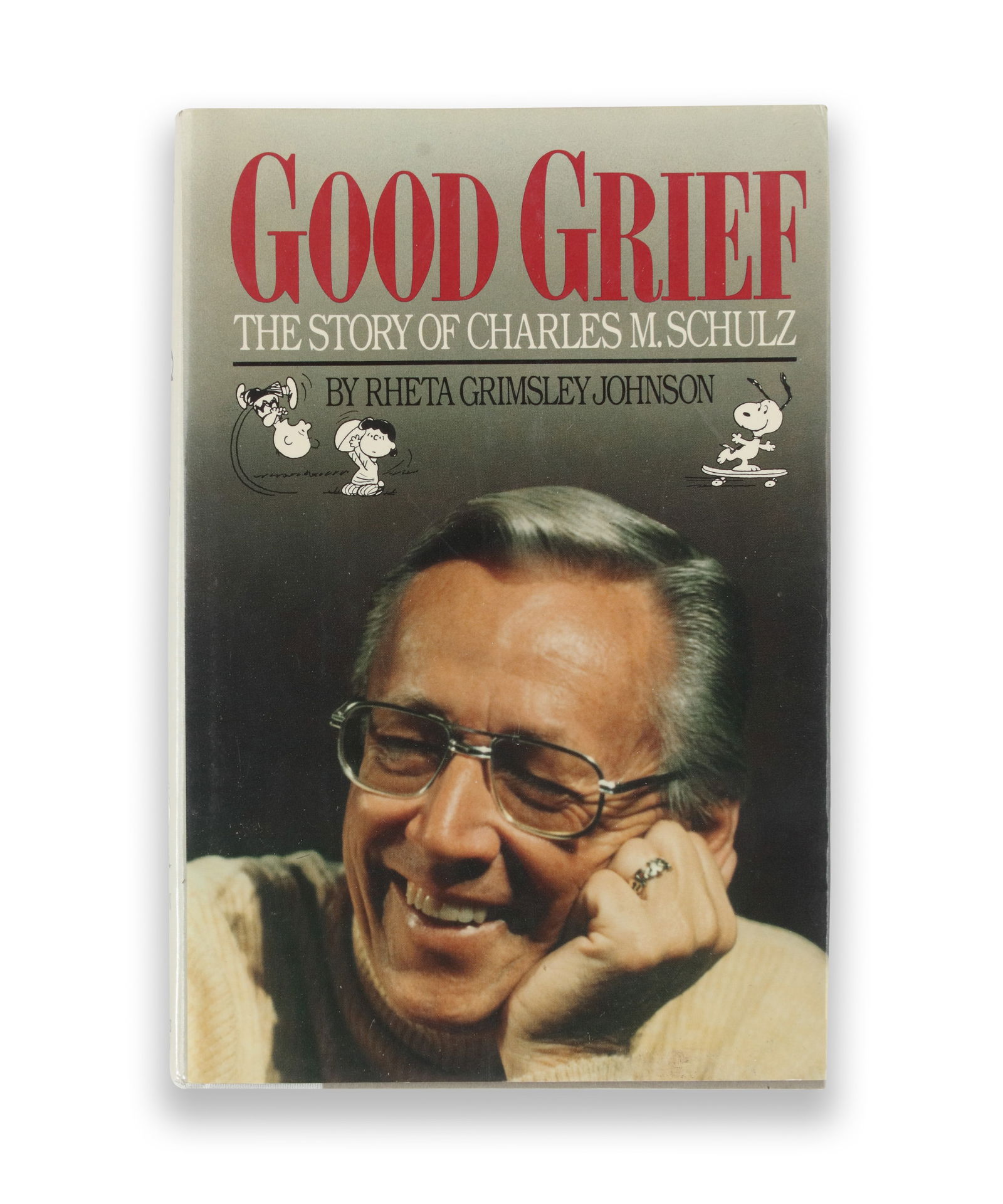 GOOD GRIEF: THE STORY OF CHARLES M. SCHULZ (PHAROS BOOKS, NEW YORK) BEARING SIGNATURE READING: Hardcover volume in publisher's cloth, accompanied by its illustrated dust jacket featuring Schulz's portrait and Peanuts characters. The book bears a signature in pencil on the title page, beneath