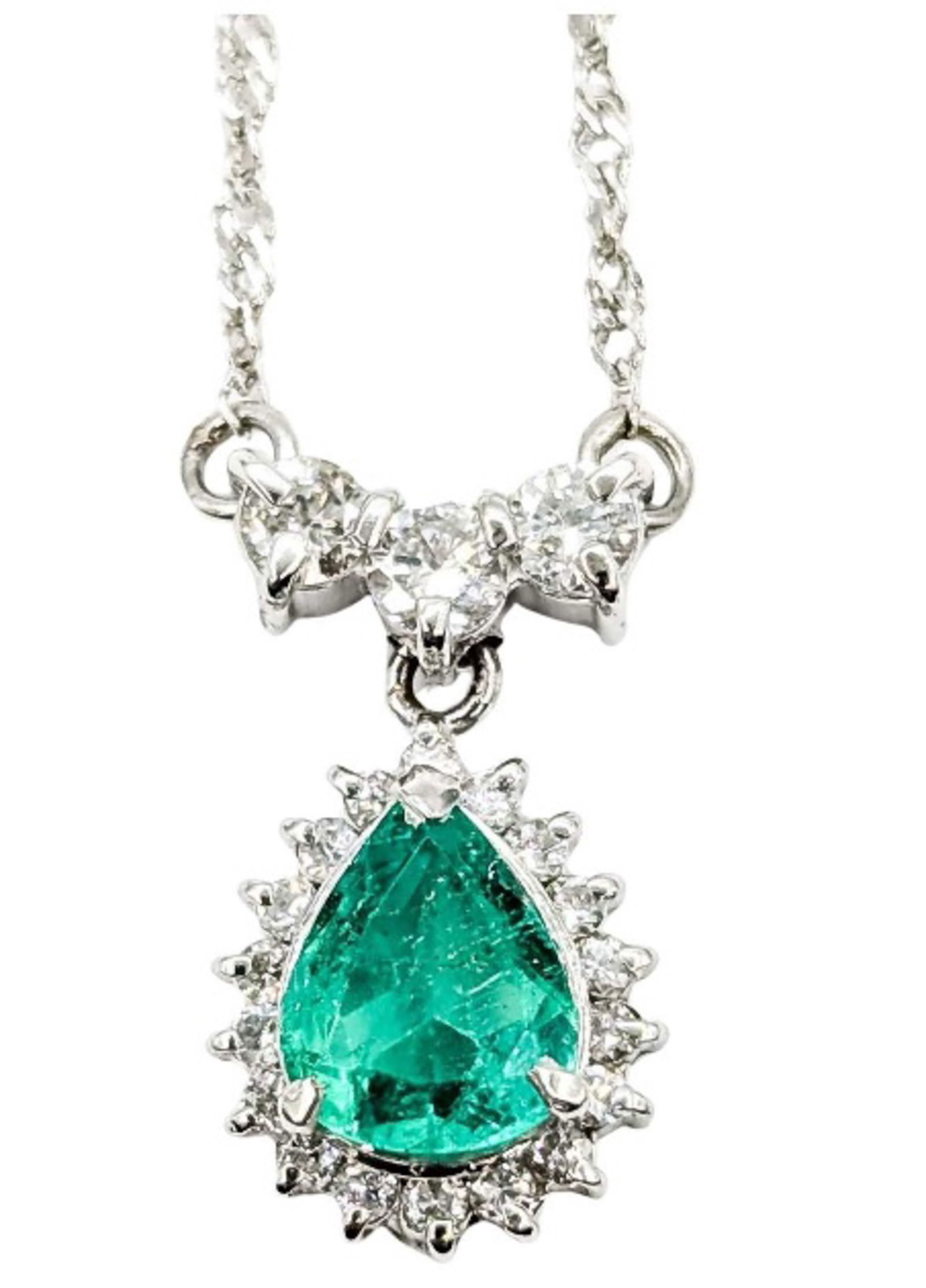 PLATINUM EMERALD AND DIAMOND DROP NECKLACE: A necklace crafted in 850 platinum, featuring a pear-cut emerald (0.70 ct) accented by a halo and drop of round diamonds (totaling 0.33 ct). The pendant is suspended from a 1.4mm platinum chain