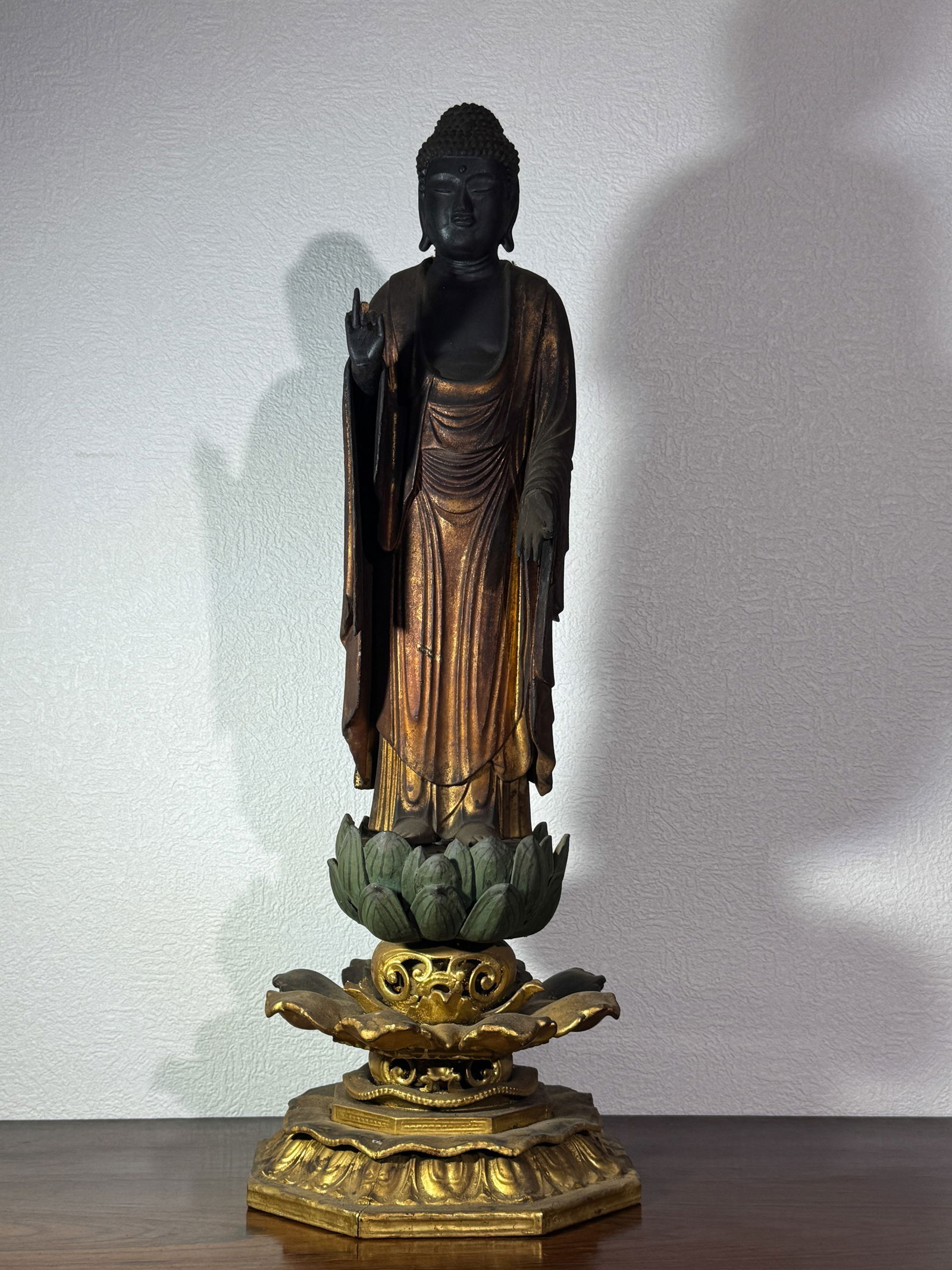 JAPANESE EDO PERIOD WOOD BUDDHA ON LOTUS BASE: Japanese edo period wood buddha on lotus form base, losses of the lacquer and wood.Dimensions: Height: 23 in. (58.4 cm)Note: This item is in New York, where it can be shipped from.