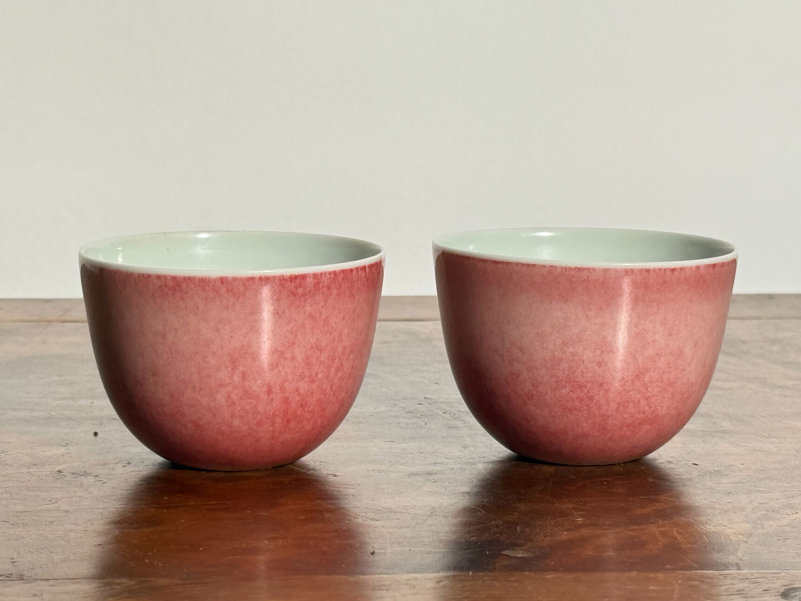 PAIR CHINESE PEACH BLOOM MONOCHROME PORCELAIN WINECUPS (1 of 9)
