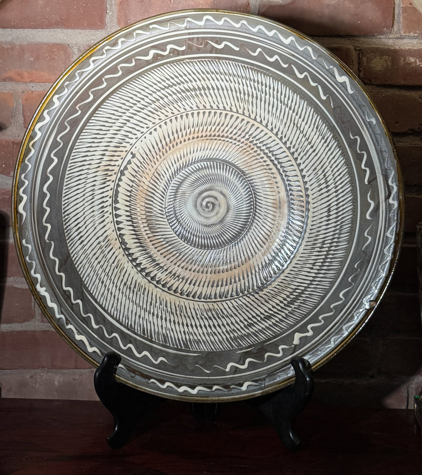 LARGE JAPANESE STUDIO PORCELAIN CHARGER WITH WOOD STORAGE BOX: Large Japanese studio porcelain charger with slip glaze, with Japanese wood storage box. Dimensions: Diameter: 21 in. (53.3 cm) Note: This item is in New York, where it can be shipped from.