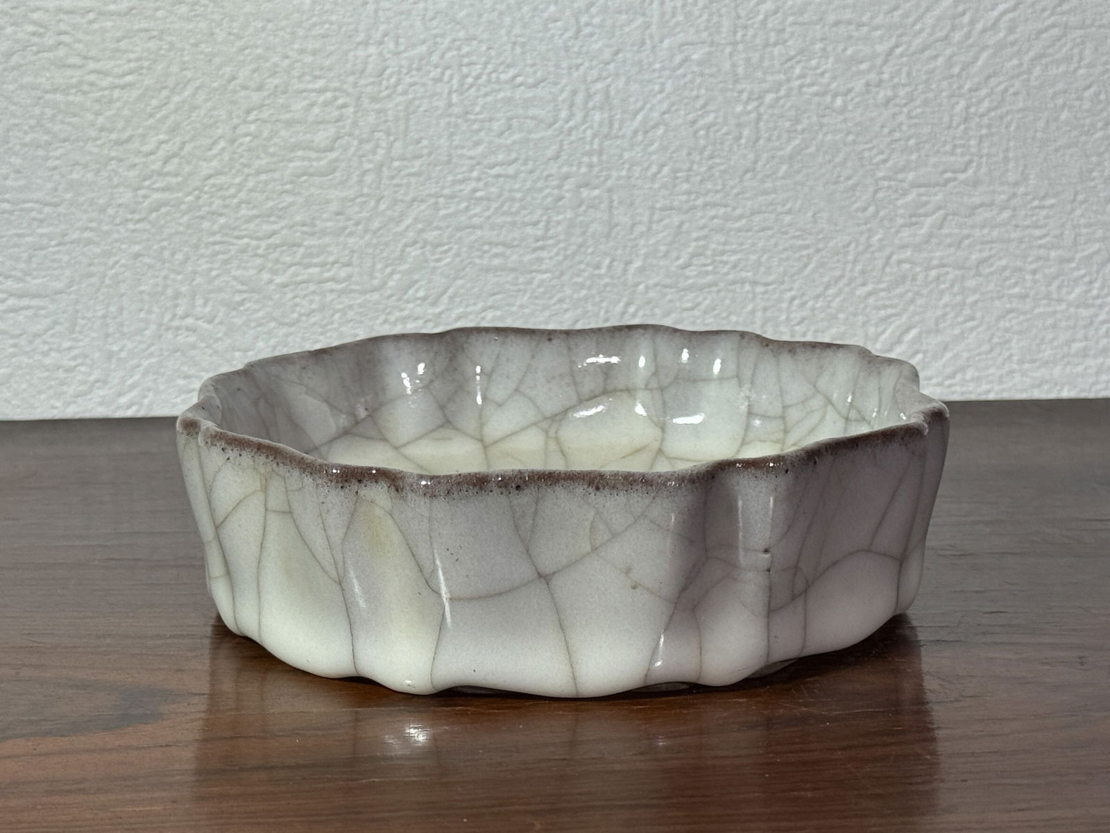 CHINESE GUAN CRACKLE BRUSH WASHER: Chinese guan crackle glazed porcelain brush washer. Dimensions: Diameter: 5.8 in. (14.7 cm); Height: 1.75 in. (4.4 cm) Note: This item is in New York, where it can be shipped from.