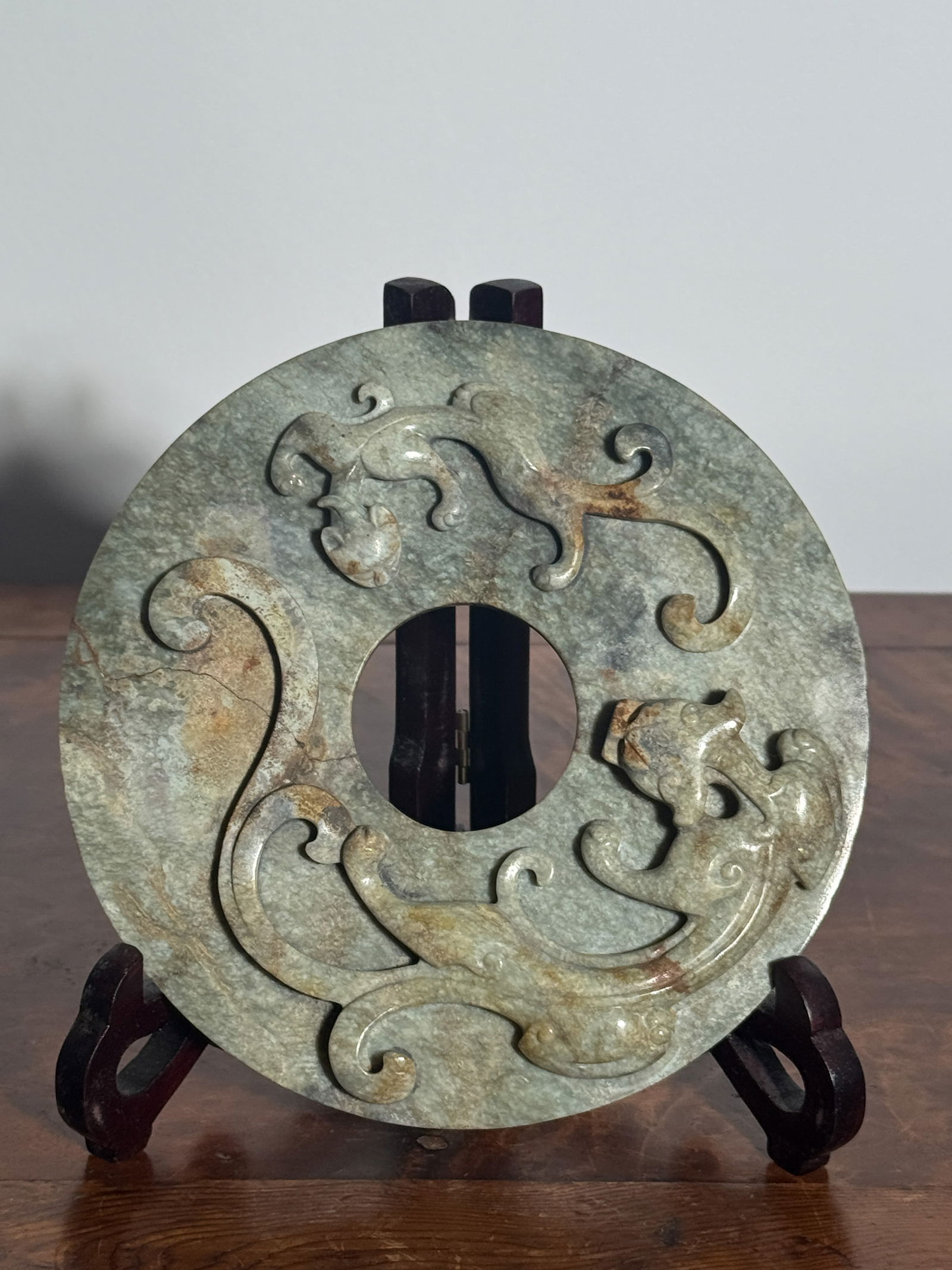CHINESE JADE PI WITH DRAGONS: Large Chinese jade pi with dragon at one side, raised dot design at reverse side, fissure as seen in photo. Dimensions: Diameter: 6 in. (15.2 cm) Note: This item is in New York, where it can be shippe