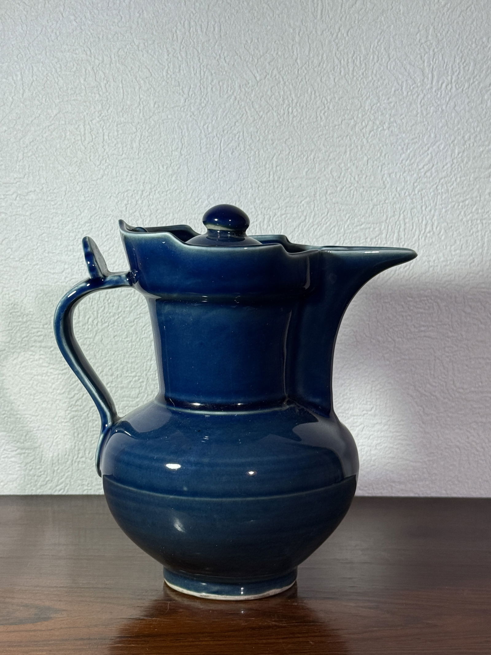 CHINESE BLUE MONOCHROME PORCELAIN EWER: Chinese ble monochrome porcelain covered ewer, with ming mark. Dimensions: Height: 8.25 in. (21.0 cm) Note: This item is in New York, where it can be shipped from.