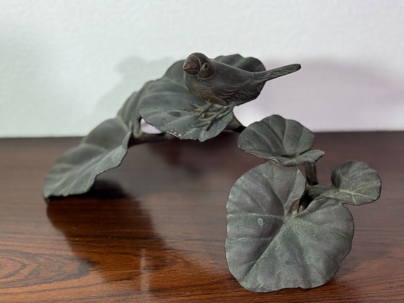 JAPANESE BRONZE OKIMONO OF BIRD ON LEAF: Japanese mixed metal bird onleaf okimono, ide. Dimensions: Width: 11.5 in. (29.2 cm) Note: This item is in New York, where it can be shipped from.