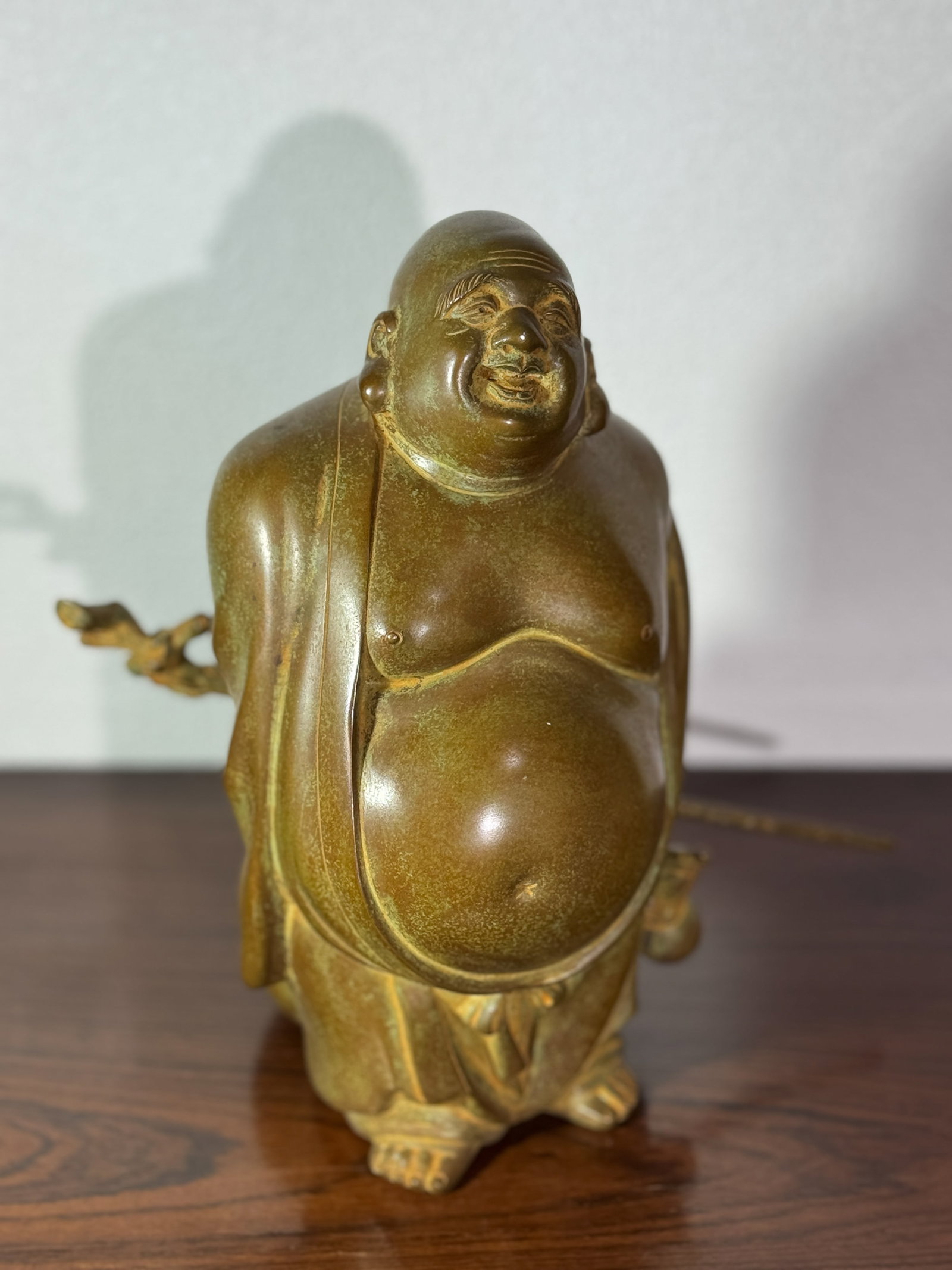 JAPANESE BRONZE HOTEI SIGNED: Japanese bronze hotei of standing form, signed at back, heavy in casting. Dimensions: Height: 10.25 in. (26.0 cm) Note: This item is in New York, where it can be shipped from.