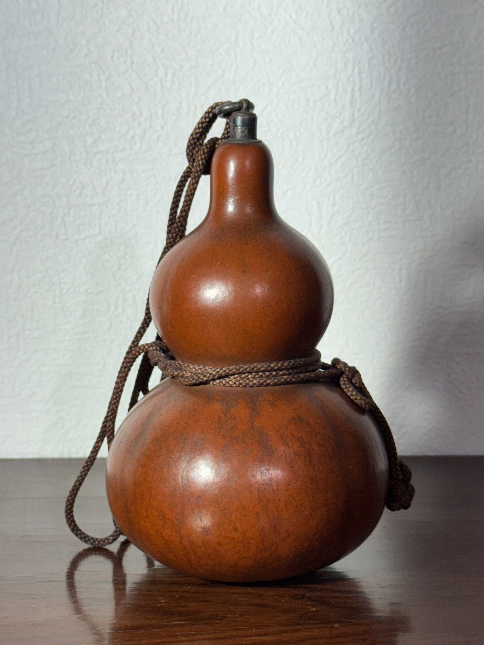 ANTIQUE JAPANESE SAKE GOURD WITH SILVER MOUNTING: Antique Japanese Meiji period doubkle gourd sake holder, with sterling silver mounth and stopper. Dimensions: Height: 6.75 in. (17.1 cm) Note: This item is in New York, where it can be shipped from.