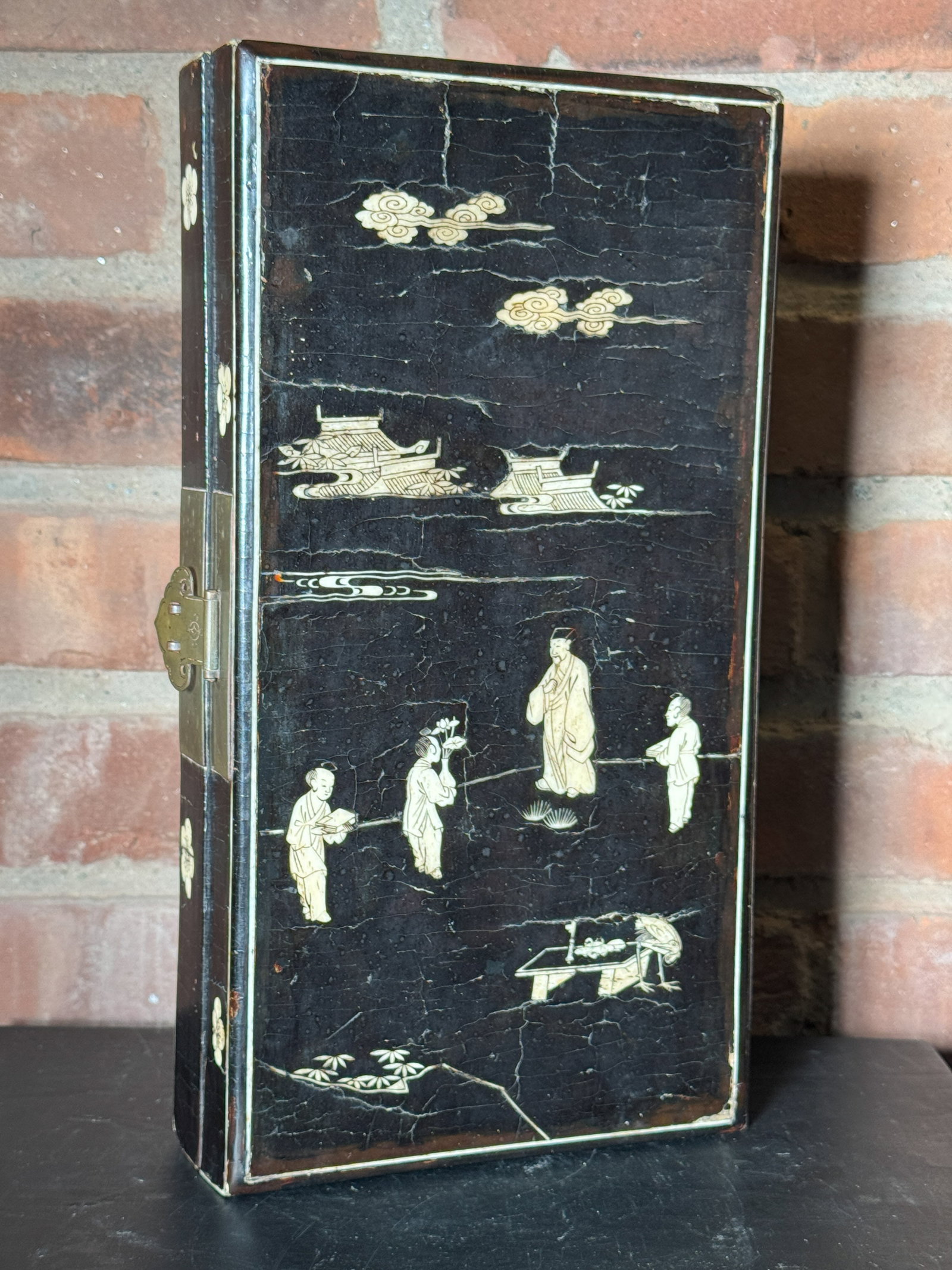 CHINESE KANGXI PERIOD SCHOLAR DOCUMENT LACQUER BOX WITH INLAY: Chinese Kangxi period black lacquer box with inlay, brass fitting, scholar scene, losses of lacquer. Dimensions: 12 x 6.5 x 2.25 in. thick (30.5 x 16.5 x 5.7 cm) Note: This item is in New York, where