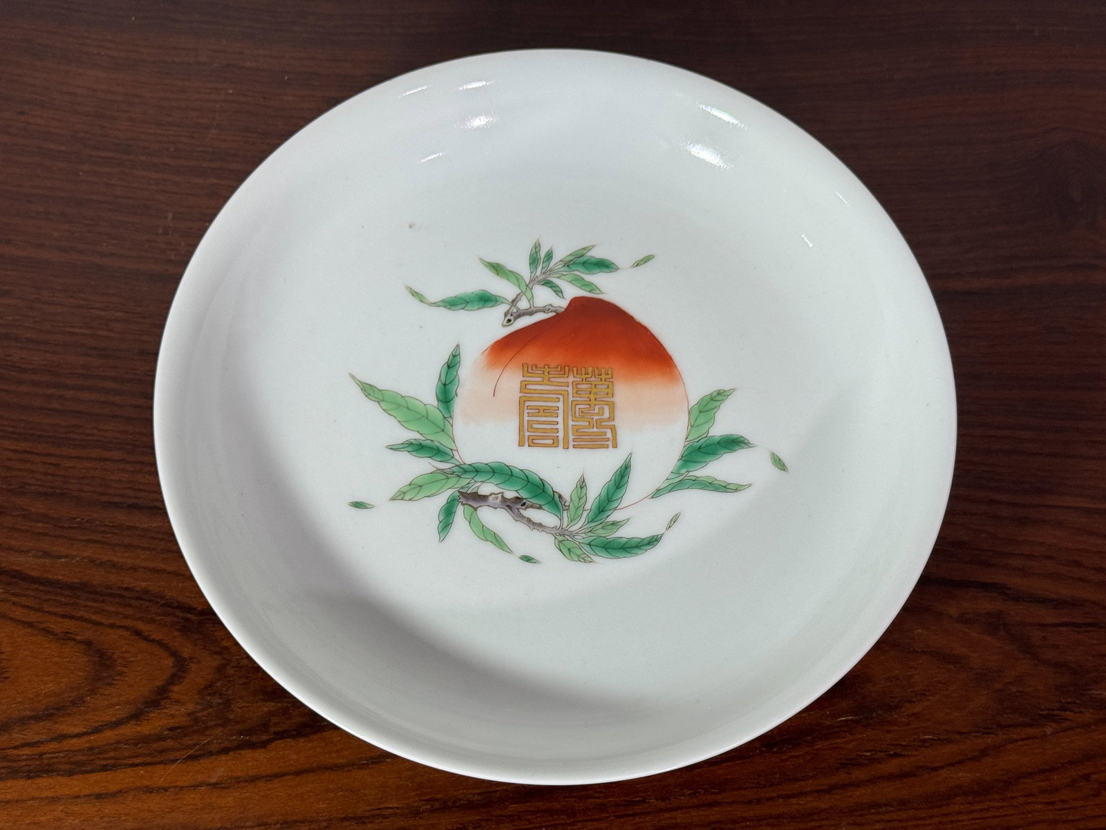 CHINESE PORCELAIN DISH WTH PEACH MOTIF: Chinese porcelain dish with peach motif, gilted shou character. Dimensions: Diameter: 8 in. (20.3 cm) Note: This item is in New York, where it can be shipped from.