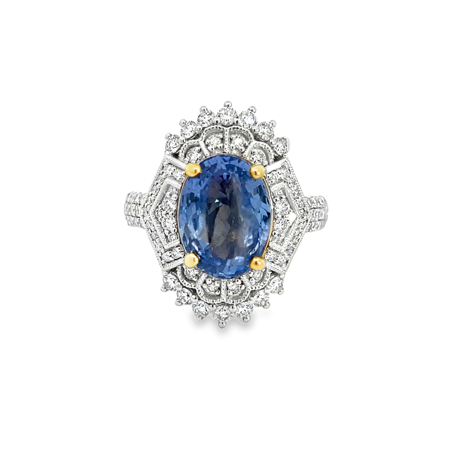 PLATINUM, 18K GOLD, NATURAL SAPPHIRE AND DIAMOND RING WITH GGA & GIA: Platinum, 18K Gold, Natural Sapphire and Diamond Ring with GGA & GIA. 8.6 grams platinum and 18K gold ring set with 0.80 carats of diamonds and 5.03 carats natural sapphire (GGA/GIA). Size: