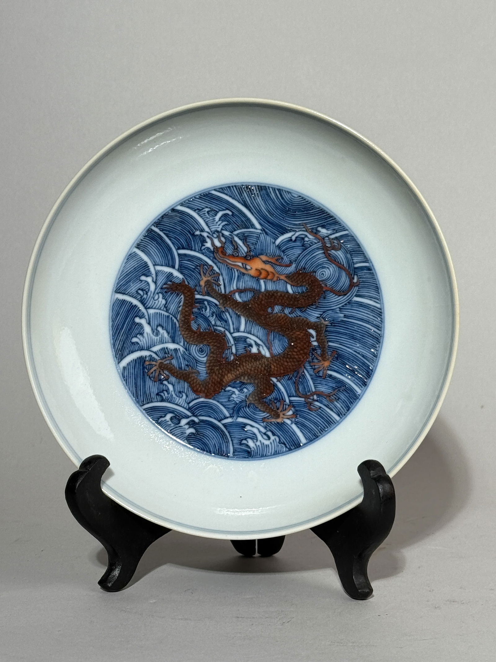 A CHINESE DOUCAI PORCELAIN DISH WITH DRAGON: A Chinese Doucai porcelain dish with a dragon motif. Dimensions: Diameter: 7 in. (17.8 cm).