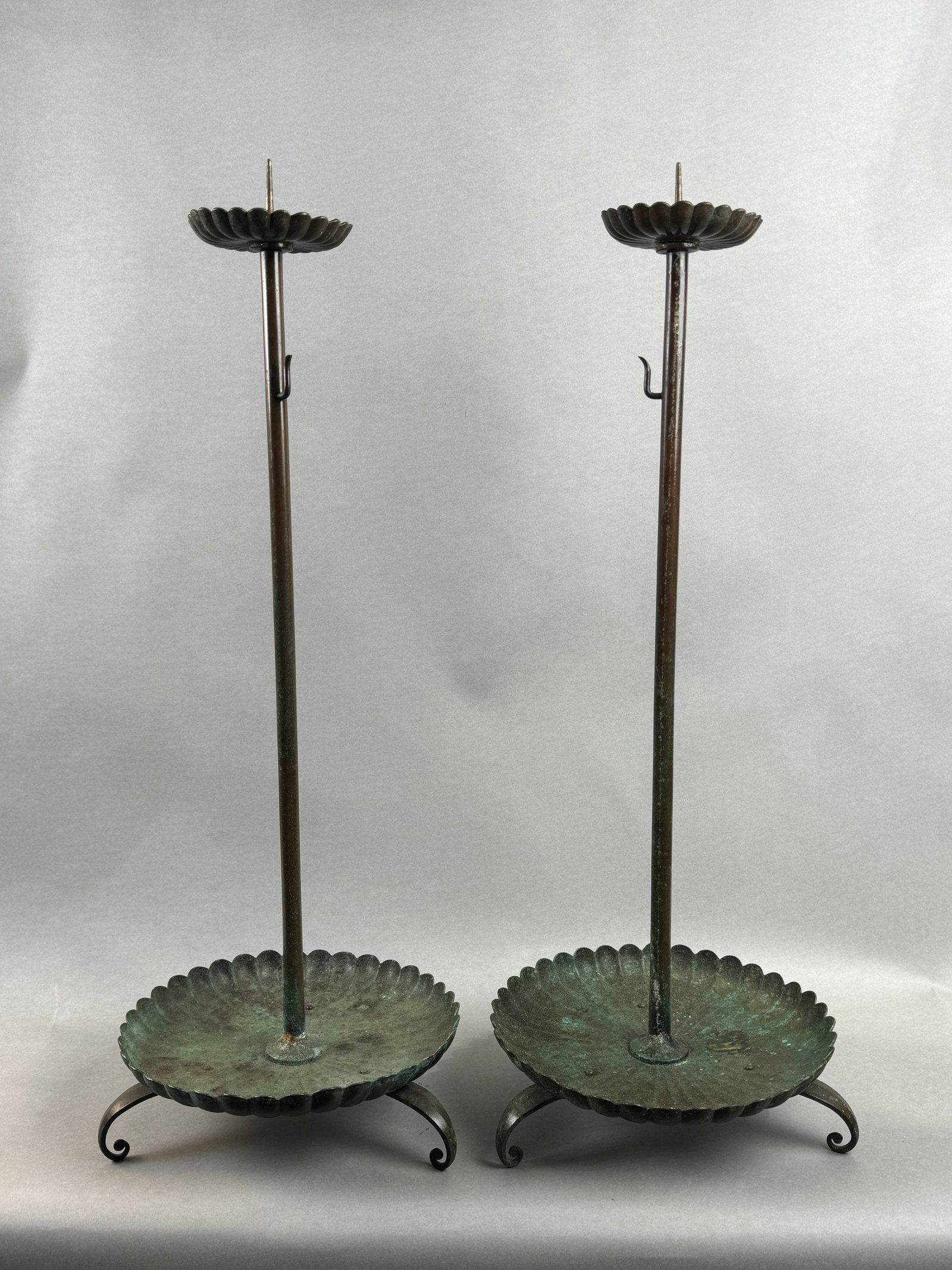 A PAIR OF JAPANESE EDO BRONZE CANDLE HOLDERS OF CHRYSANTHEMUM MOTIF: A pair of Japanese Edo bronze candle holders of chrysanthemum motif, Edo period. Dimensions: Height: 26.5 in. (67.3 cm).