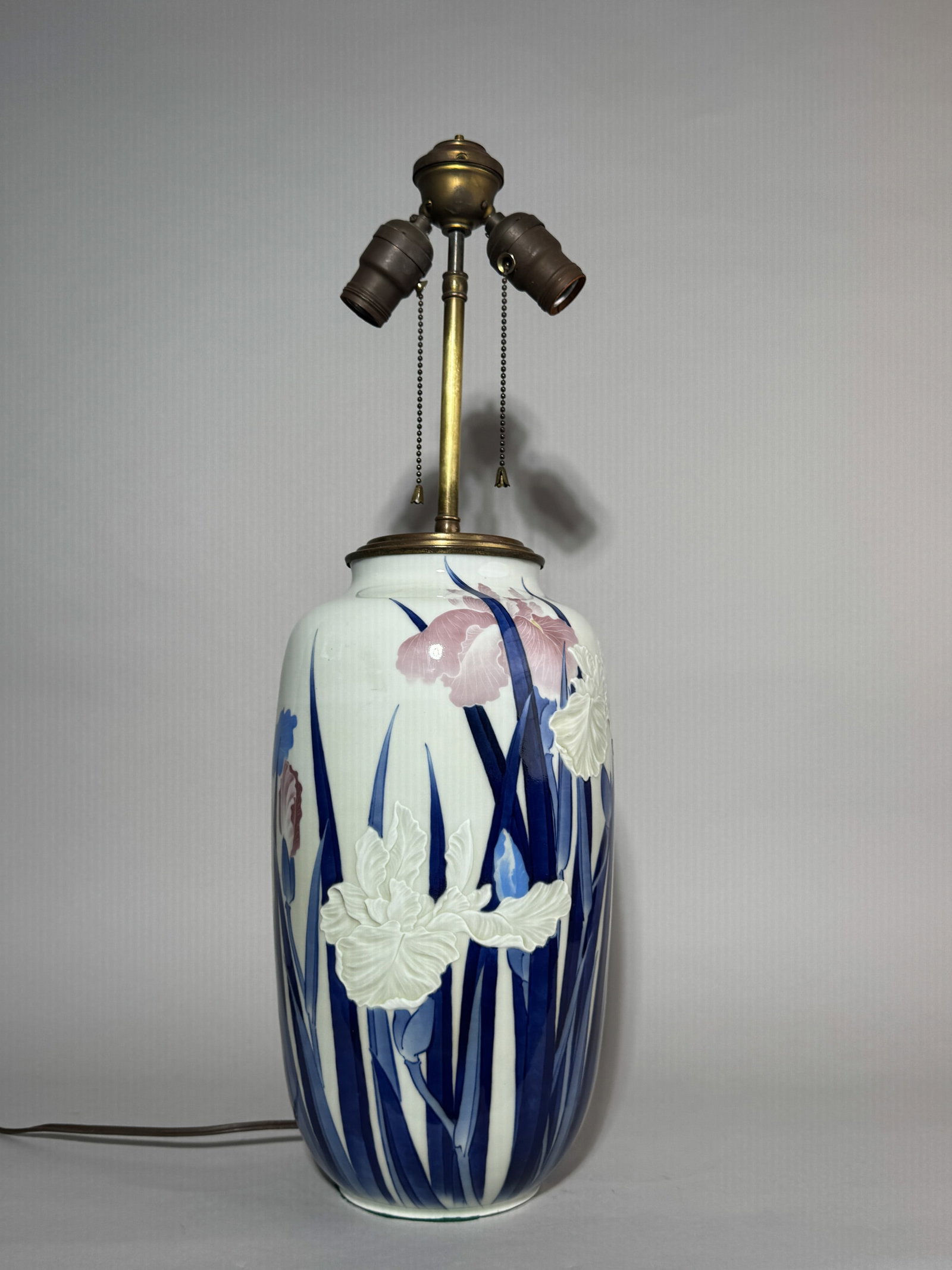 A LARGE JAPANESE STUDIO PORCELAIN VASE WITH IRIS MOTIF: A large Japanese studio porcelain vase with an iris motif, mounted as a lamp, the bottom is not drilled, with a side drill for the wire to route out. The bottom has a mark. Dimensions: Vase height: 14