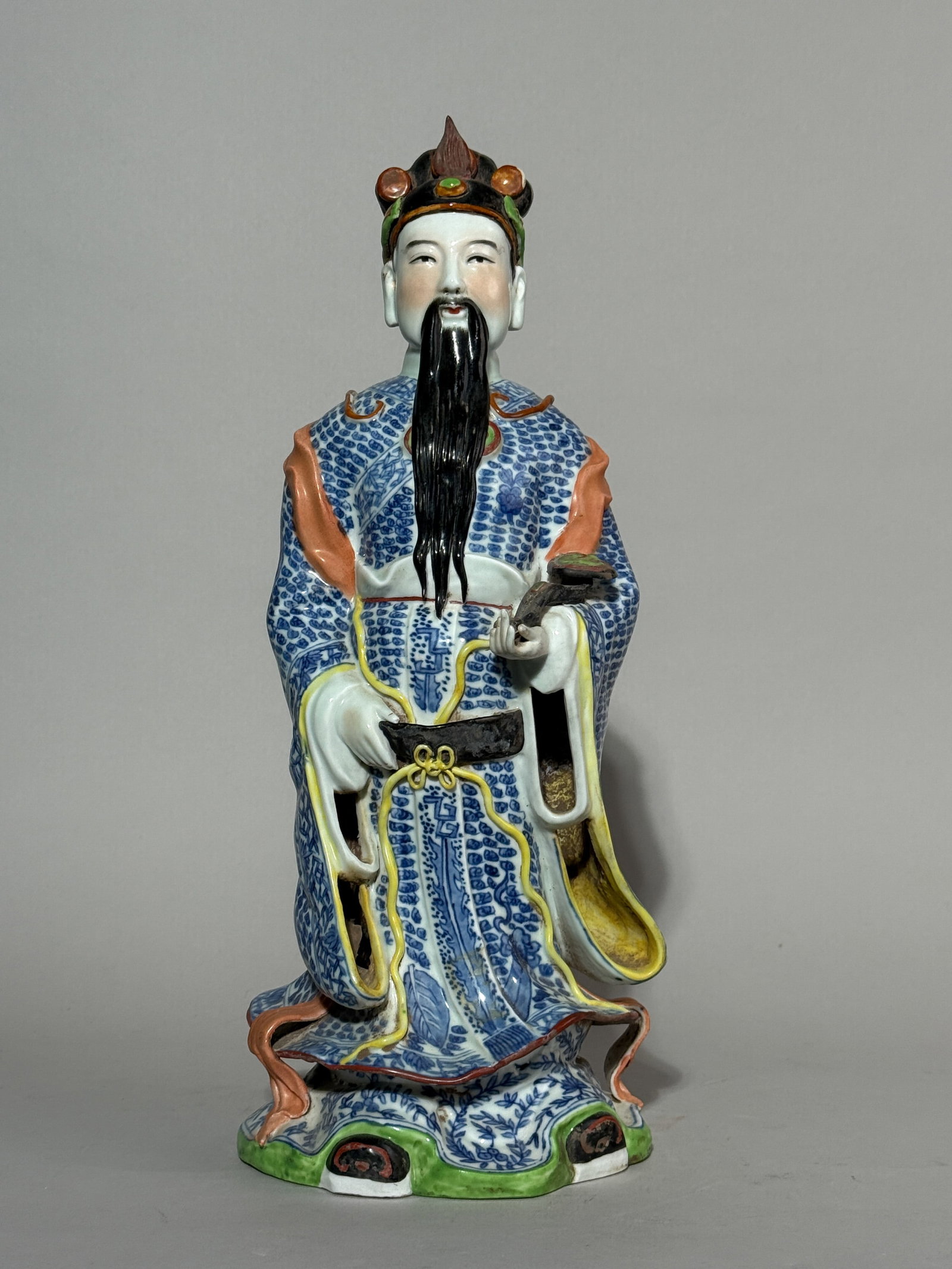 A CHINESE PORCELAIN IMMORTAL FIGURINE: A Chinese porcelain immortal figurine holding a scepter. Dimensions: Height: 14.5 in. (36.8 cm).