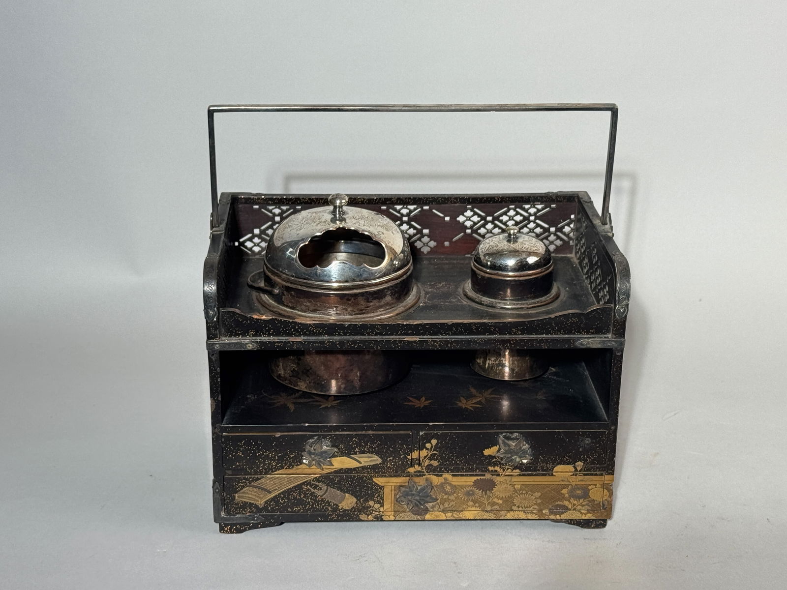 A JAPANESE MEIJI LACQUER TOBACCO CHEST WITH SILVER FITTINGS: A Japanese Meiji lacquer tobacco chest with silver containers. The larger container weighs 345 grams (11.1 ozt), and the smaller one weighs 140 grams (4.5 ozt). Features silver corner fittings and han