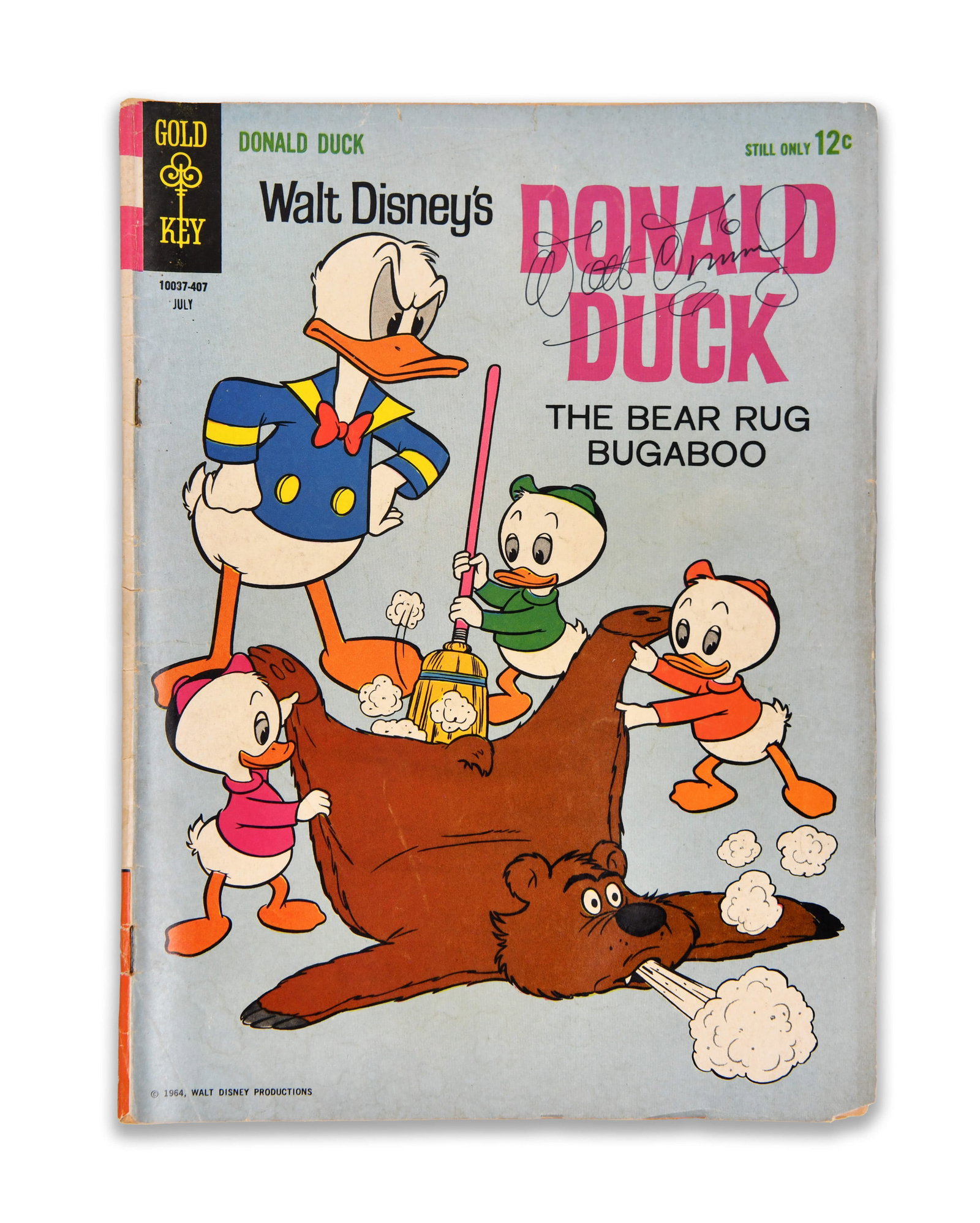 COMIC "WALT DISNEY'S DONALD DUCK - THE BEAR RUG BUGABOO" BEARING SIGNATURE ATTRIBUTED TO WALT DISNEY: The cover features an illustrated scene of Donald Duck alongside his nephews, framed by the Gold Key masthead and Disney typography. The title area bears an ink mark attributed to Walt Disney. The com