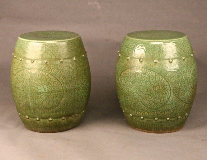 A Pair of Chinese Celadon Porcelain Garden Stools: A Pair of Chinese Celadon Porcelain Garden Stools. Height 17" Width 14" 龙泉瓷凳一对