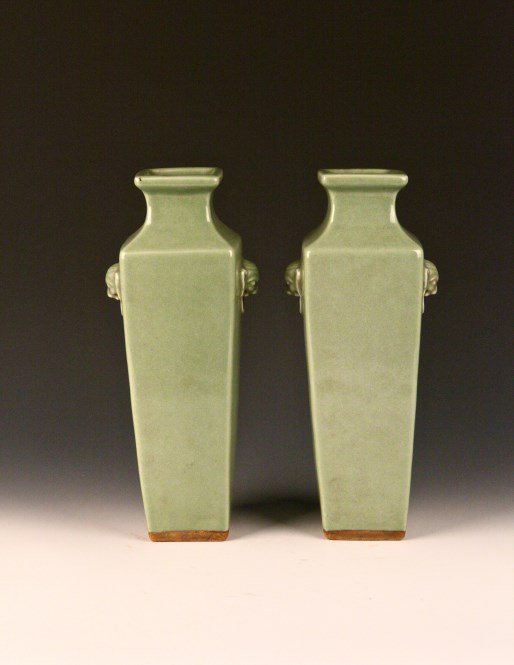 A Pair of Celadon Porcelain Vase: A pair of Celadon Porcelain Vase, of square section and high shoulder form with a pair of elephant-head handles attached to the flaring neck. Height 12.5" Width 4.75" 龙泉方瓷&