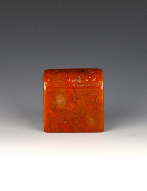 Ox-blood Stone seal: Chinese ox-blood stone seal, carved with a few calligraphy characters. Height 2.25" Length 2.25" Width 1" 鸡血石印章