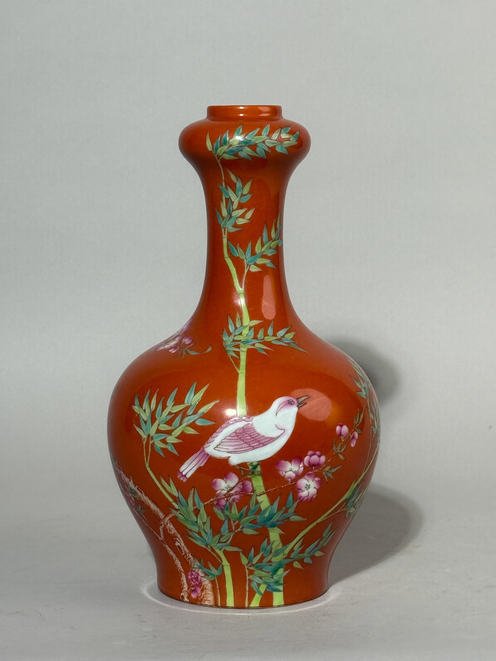 A CHINESE CORAL-RED PORCELAIN VASE WITH BIRD: A Chinese coral-red porcelain vase with a bird motif. Dimensions: Height: 8.75 in. (22.2 cm). Note: This item is in New York, where it can be shipped from.