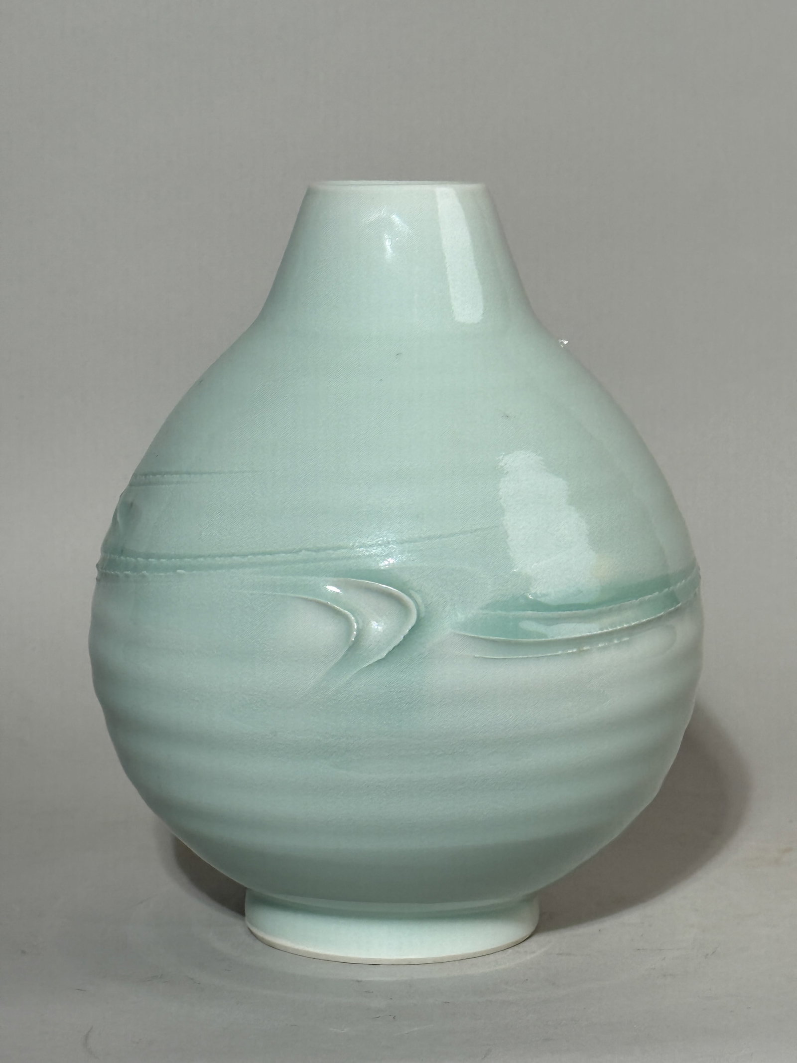 A JAPANESE STUDIO PORCELAIN VASE WITH MODERN DESIGN: A Japanese studio porcelain vase with a modern design, with an incised maker's mark at the bottom. Dimensions: Height: 8.5 in. (21.6 cm). Note: This item is in New York, where it can be shipped from.