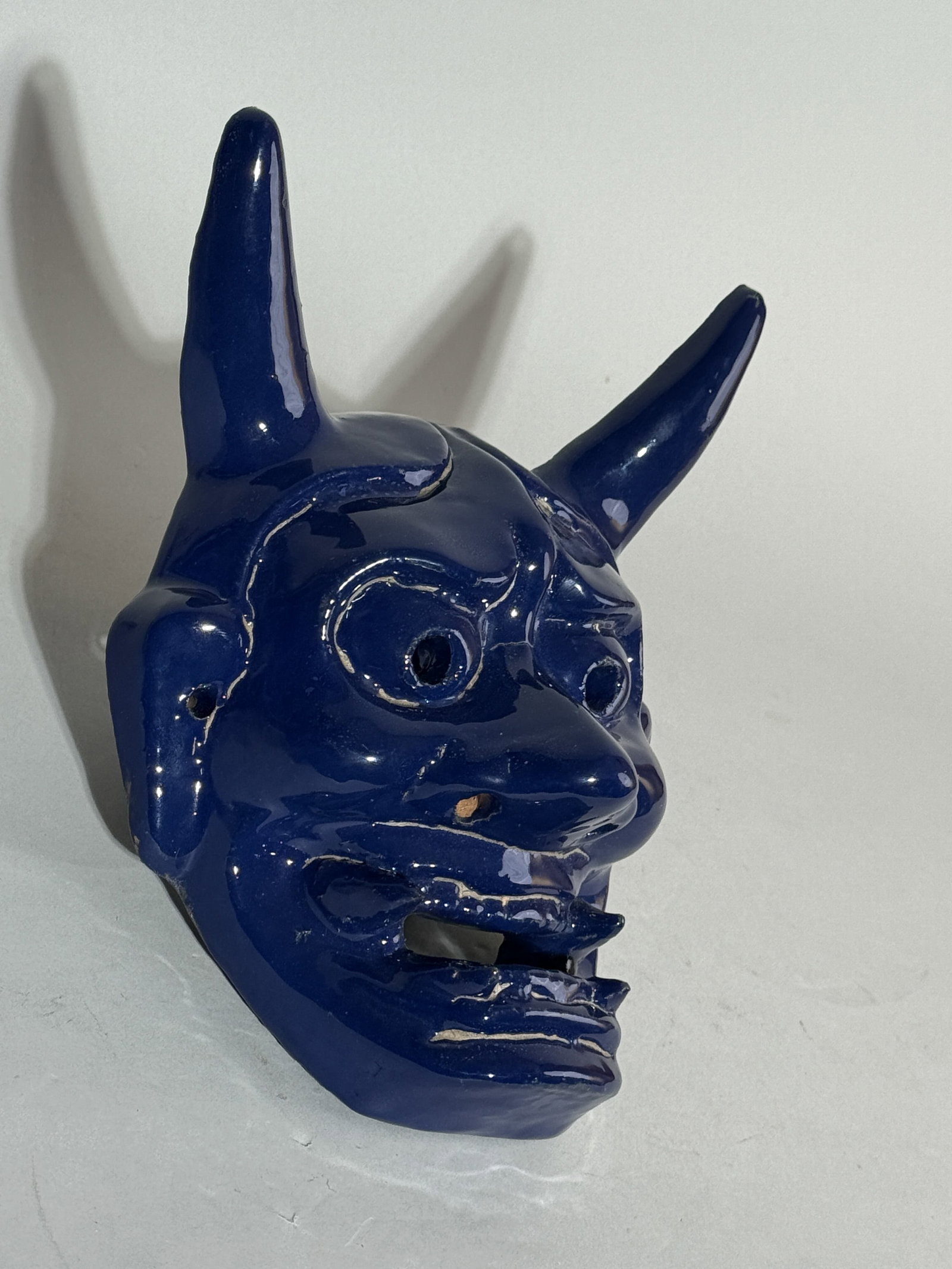 A JAPANESE CERAMIC NOH MASK OF ONI (1 of 6)