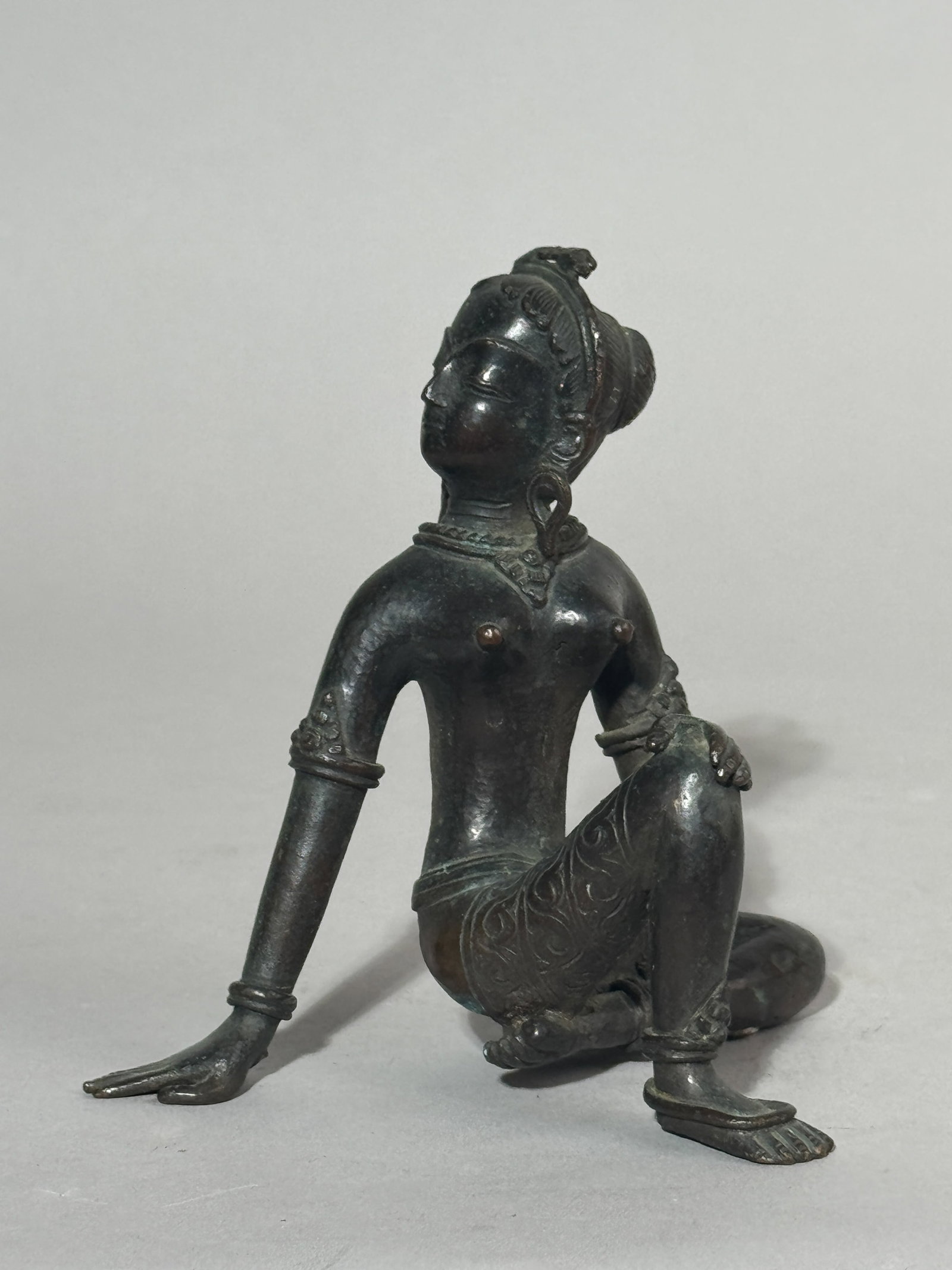 AN ANTIQUE NEPALESE BRONZE SEATED TARA (1 of 8)