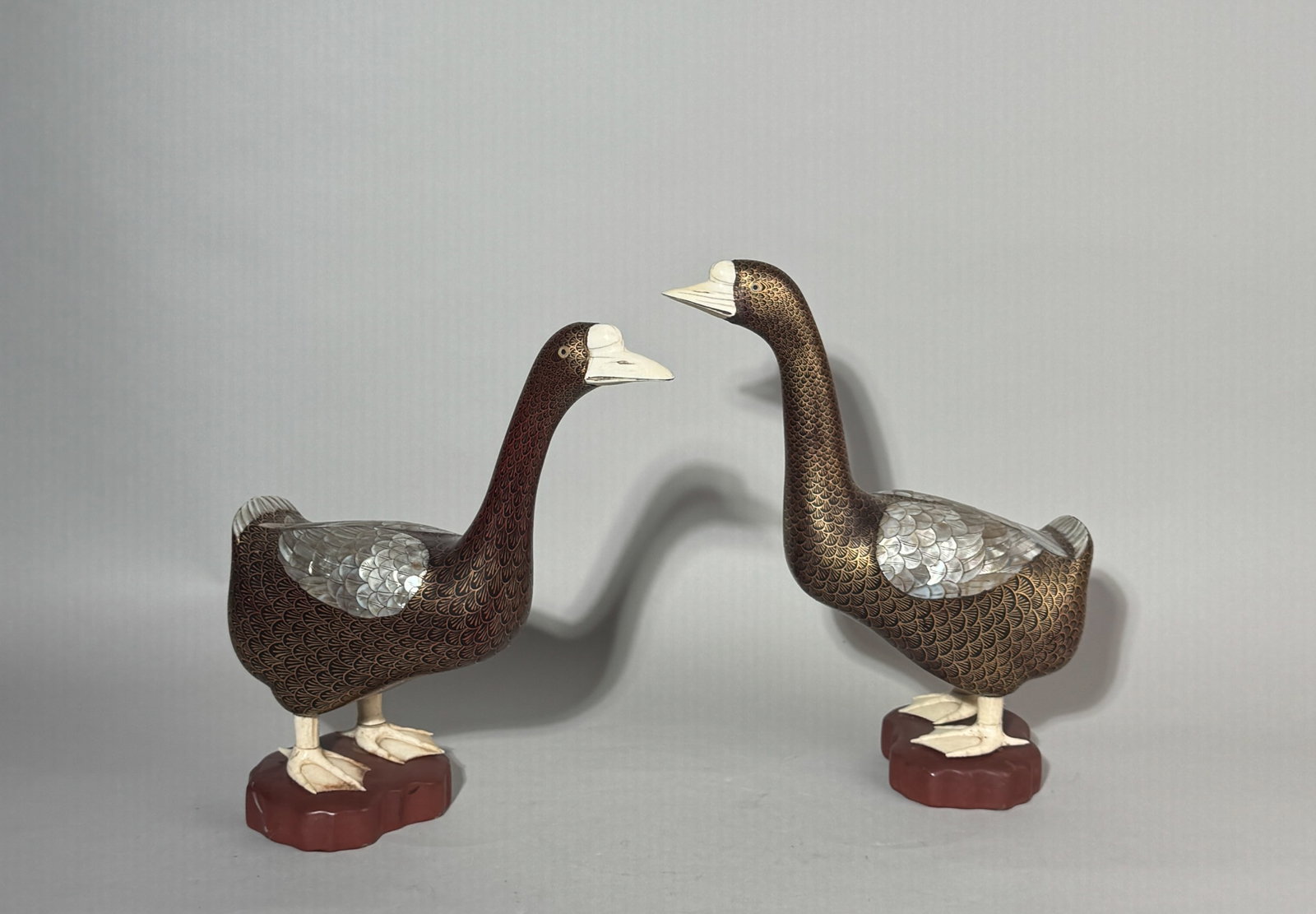 A PAIR OF CHINESE LACQUERED WOOD DUCKS WITH MOTHER-OF-PEARL FEATHERS (1 of 9)