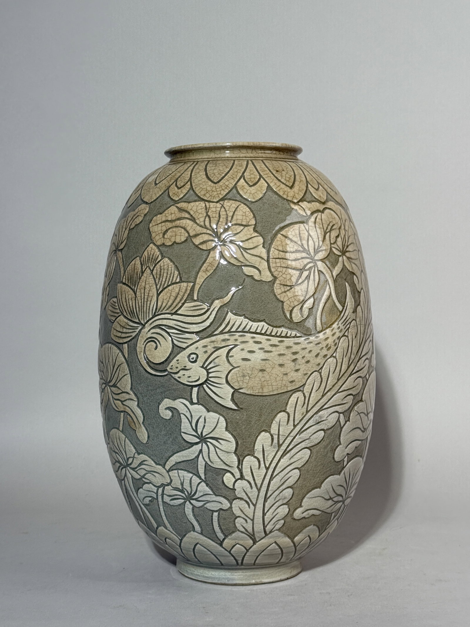 A KOREAN PORCELAIN VASE WITH INCISED FISH SCENE (1 of 14)