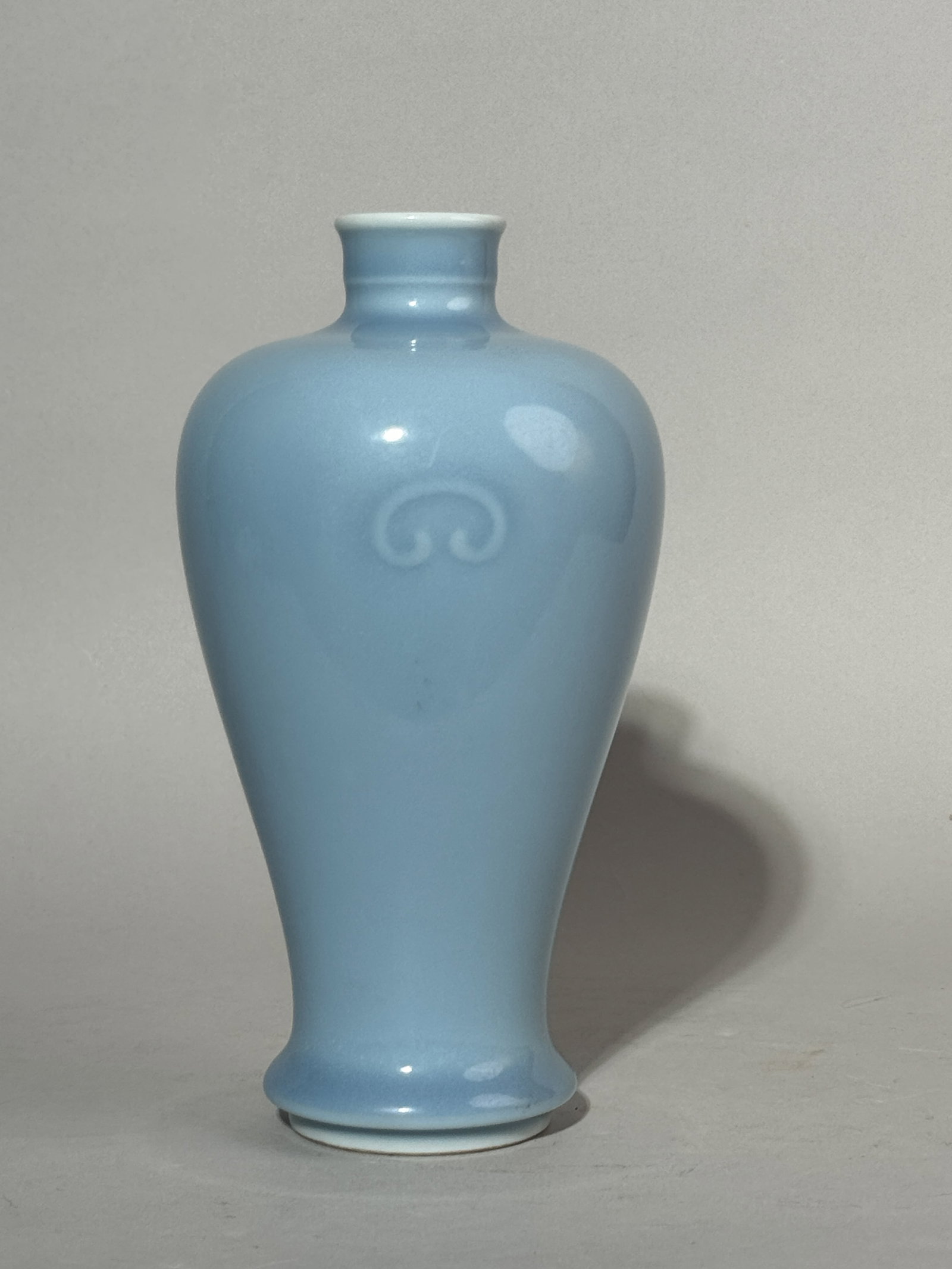 A CHINESE BLUE MONOCHROME PORCELAIN VASE: A Chinese blue monochrome porcelain vase of Meiping shape. Dimensions: Height: 8 in. (20.3 cm). Note: This item is in New York, where it can be shipped from.