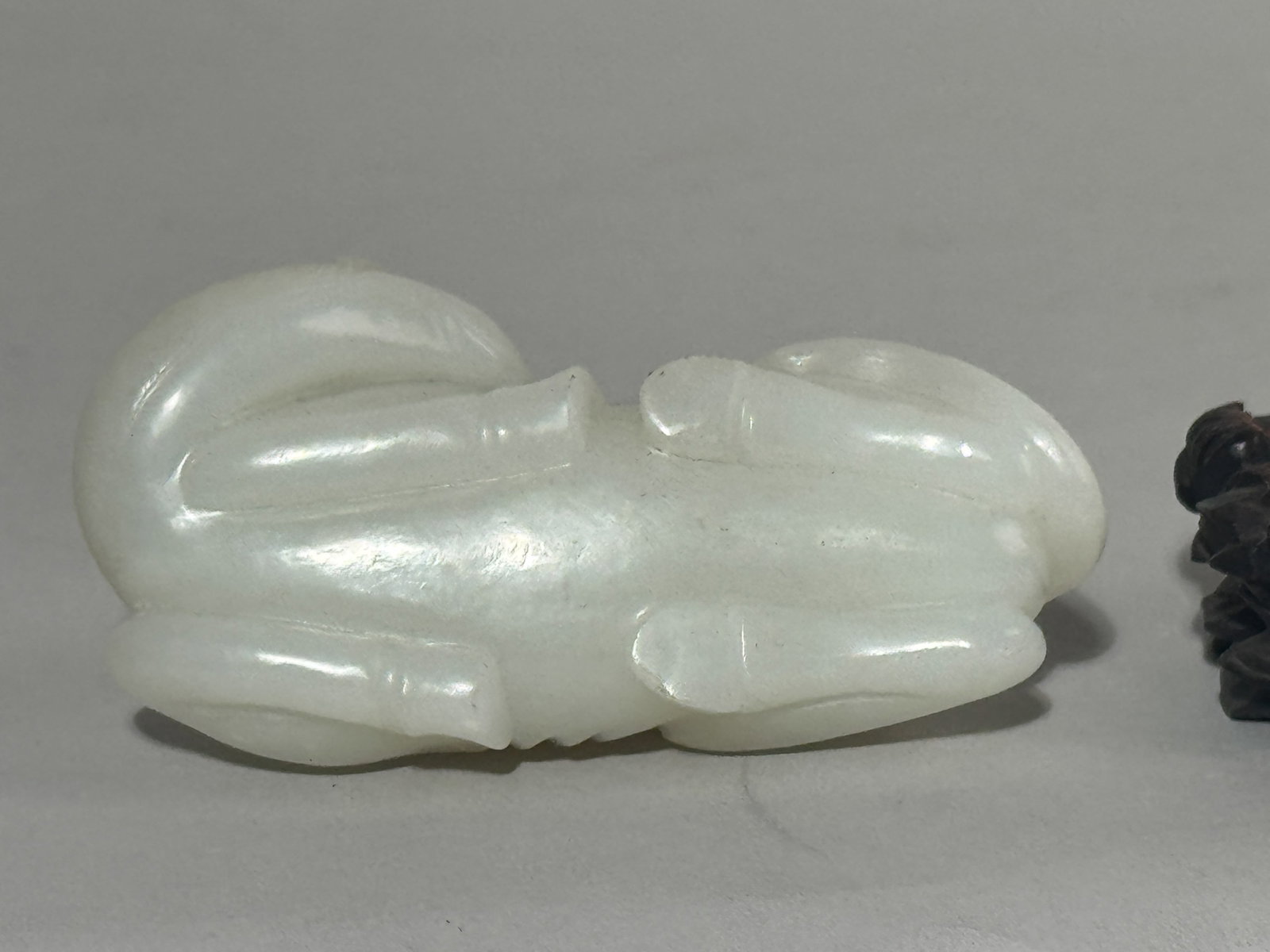 A CHINESE WHITE JADE CAMEL ON FANCY HARDWOOD STAND - 10