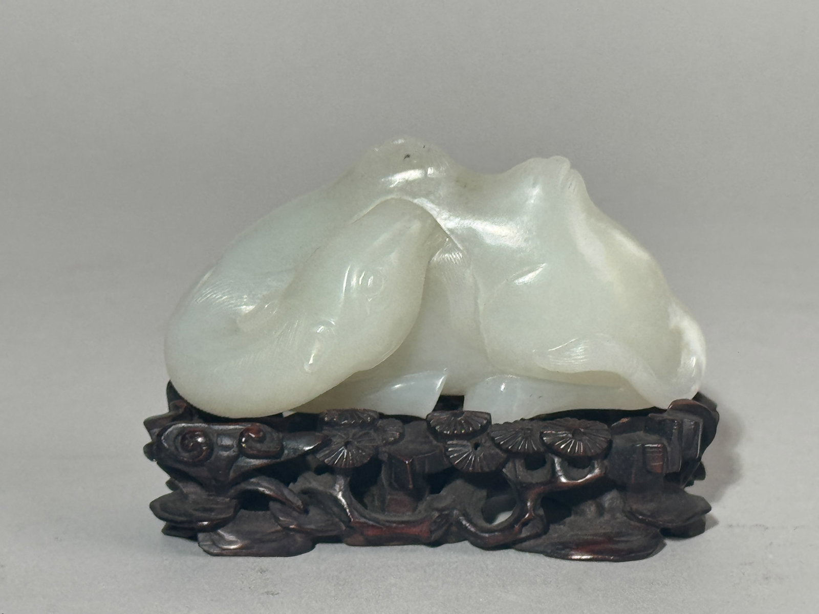 A CHINESE WHITE JADE CAMEL ON FANCY HARDWOOD STAND (1 of 11)