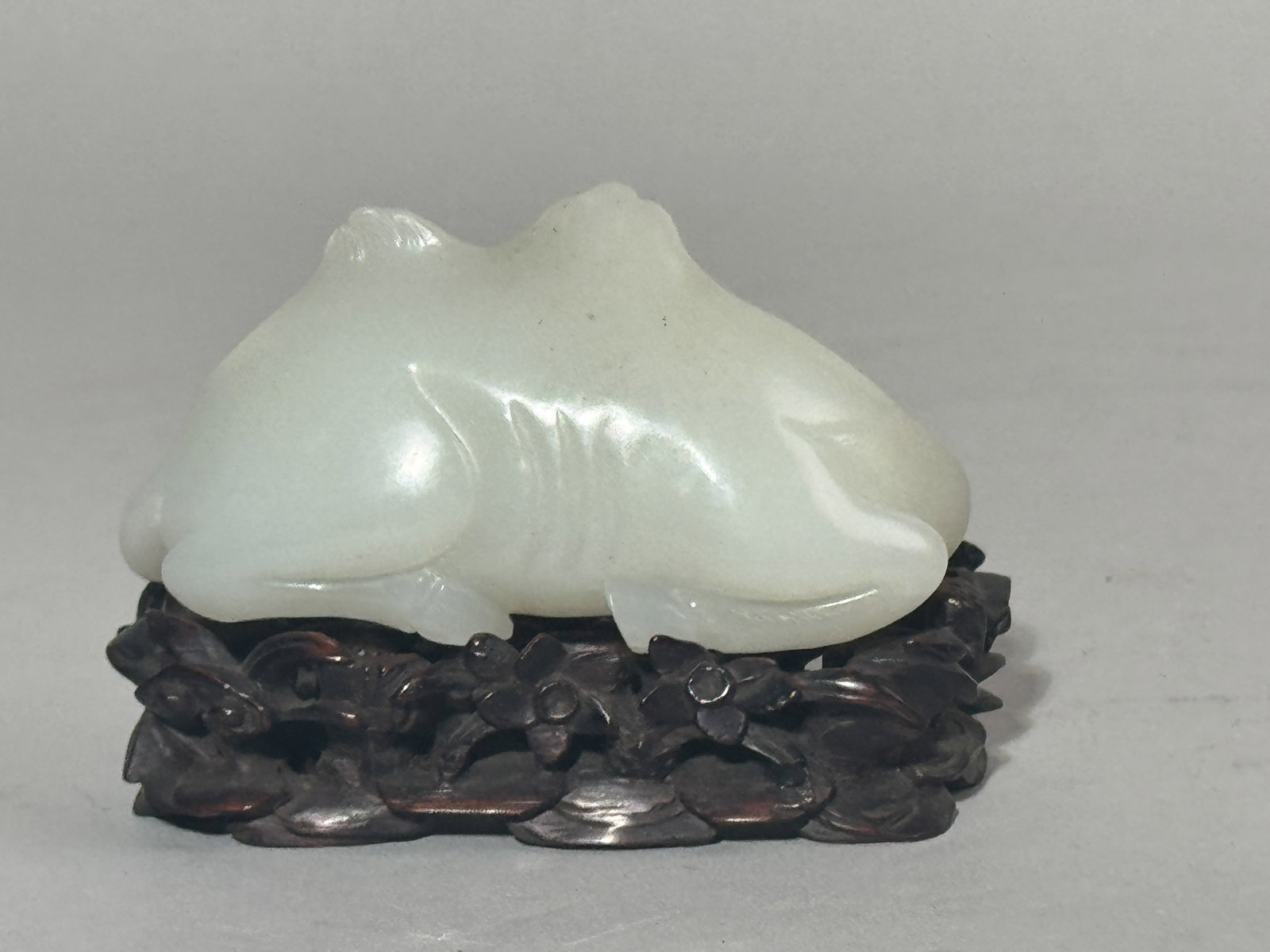 A CHINESE WHITE JADE CAMEL ON FANCY HARDWOOD STAND - 6