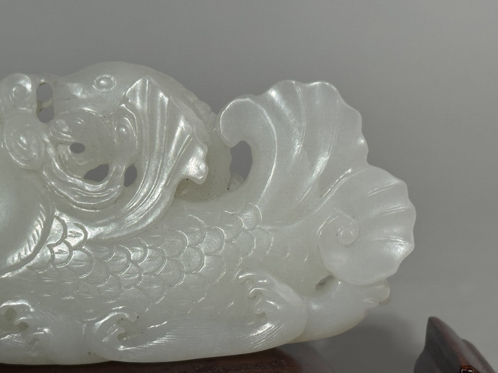 A CHINESE WHITE JADE DRAGON FISH ON SILVER-INLAID WOOD STAND - 2