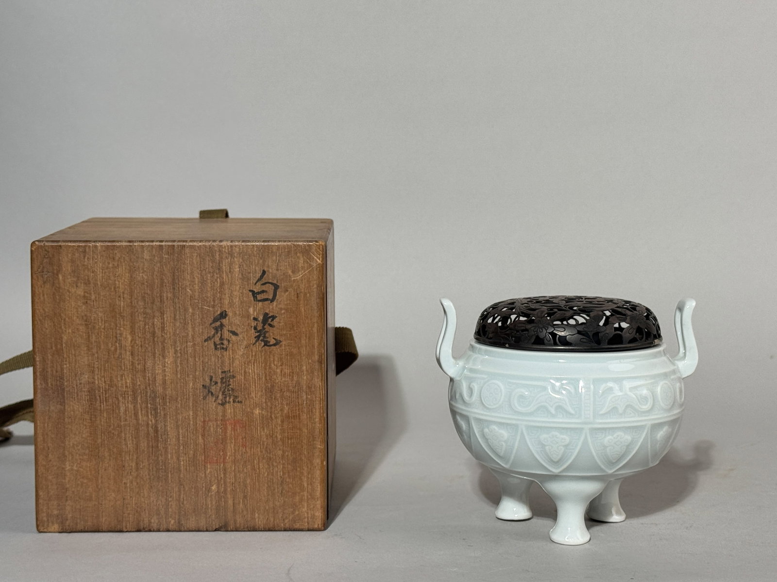A JAPANESE STUDIO PORCELAIN CENSER WITH BOX: A Japanese studio porcelain censer with a sterling silver cover, accompanied by a wood box. Dimensions: Censer height: 4 in. (10.2 cm). Note: This item is in New York, where it can be shipped from.