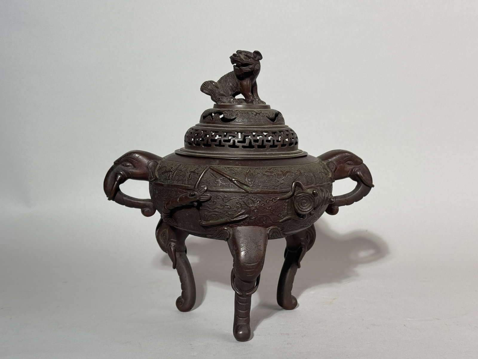 CHINESE BRONZE CENSER WITH ELEPHANT HANDLE: An antique Chinese bronze censer with elephant handles. Dimensions: Height: 9.75 in. (24.8 cm). Note: This item is in New York, where it can be shipped from.