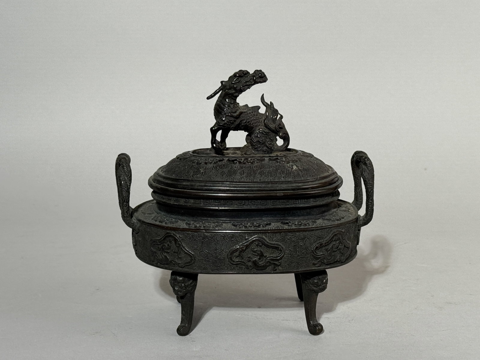 JAPANESE MEIJI BRONZE CENSER WITH KIRIN FINIAL: A Japanese Meiji period bronze censer with a kirin finial, signed. Dimensions: Height: 6 in. (15.2 cm); Width: 6 in. (15.2 cm). Note: This item is in New York, where it can be shipped from.