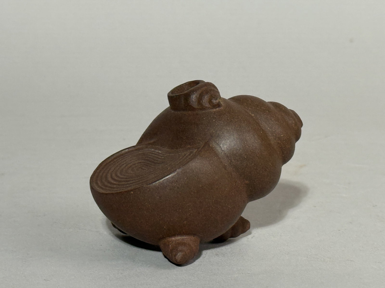 CHINESE YIXING SNAIL SCHOLAR WATER DROPPER: A Chinese Yixing scholar water dropper in the form of a snail. Dimensions: Length: 3.5 in. (8.9 cm). Note: This item is in New York, where it can be shipped from.
