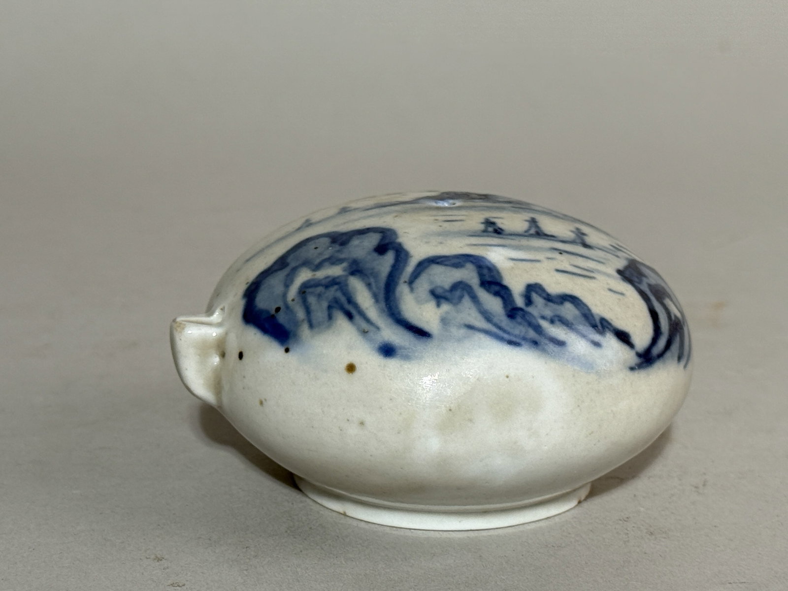 KOREAN BLUE AND WHITE SCHOLAR PORCELAIN WATER DROPPER: A Korean blue and white porcelain scholar water dropper decorated with a landscape scene. Dimensions: Width: 3.75 in. (9.5 cm). Note: This item is in New York, where it can be shipped from.