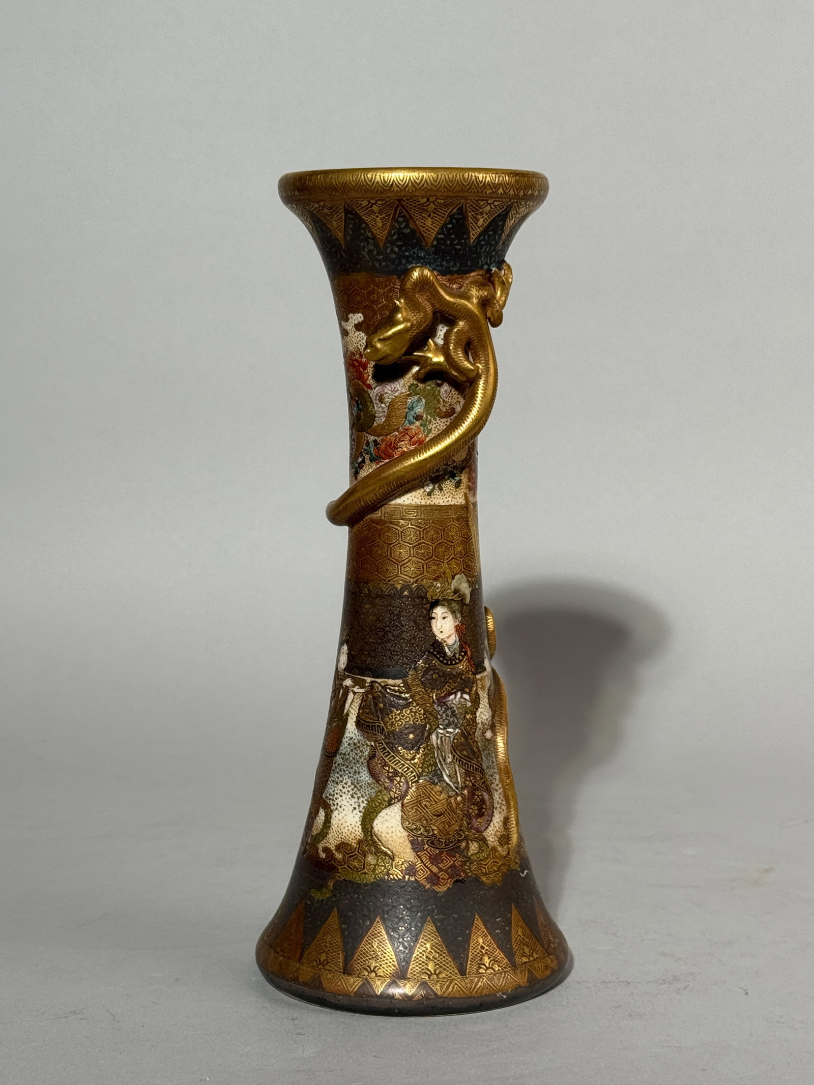 JAPANESE KYOTO SATSUMA VASE WITH DRAGON: A Japanese Kyoto Satsuma vase with a dragon on a gold ground and a figural scene, Meiji period, bottom with a mark. Dimensions: Height: 8 in. (20.3 cm). Note: This item is in New York, where it can be
