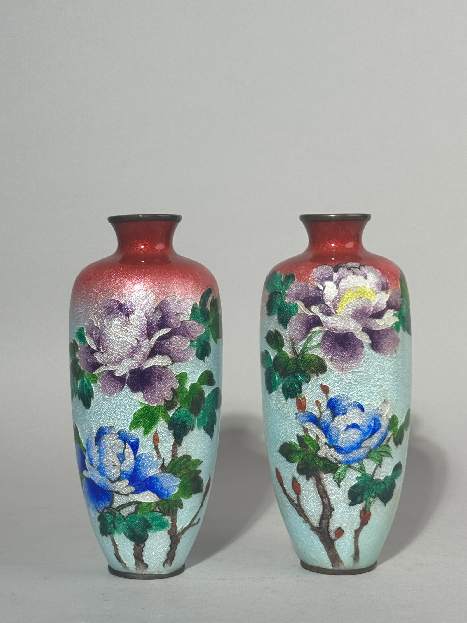 PAIR OF JAPANESE GINBARI CLOISONNE VASES: A pair of Japanese Meiji period ginbari cloisonne vases with a floral motif, unsigned. Dimensions: Height: 7.25 in. (18.4 cm). Note: This item is in New York, where it can be shipped from.