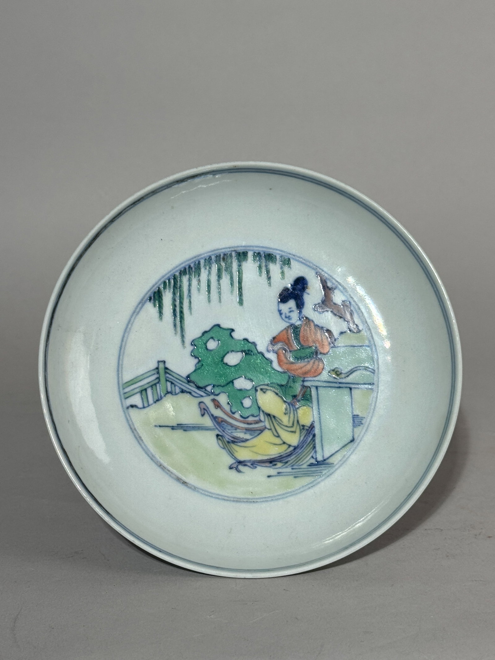 CHINESE DOUCAI DISH WITH LADY SCENE: A Chinese Doucai dish depicting a lady in a garden scene. Dimensions: Diameter: 6 in. (15.2 cm). Note: This item is in New York, where it can be shipped from.