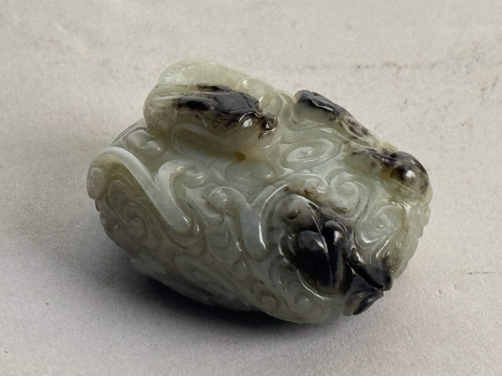 CHINESE JADE CARVING OF DRAGON: A Chinese jade carving of a pendant with a dragon motif. Dimensions: Length: 2 in. (5.1 cm). Note: This item is in New York, where it can be shipped from.