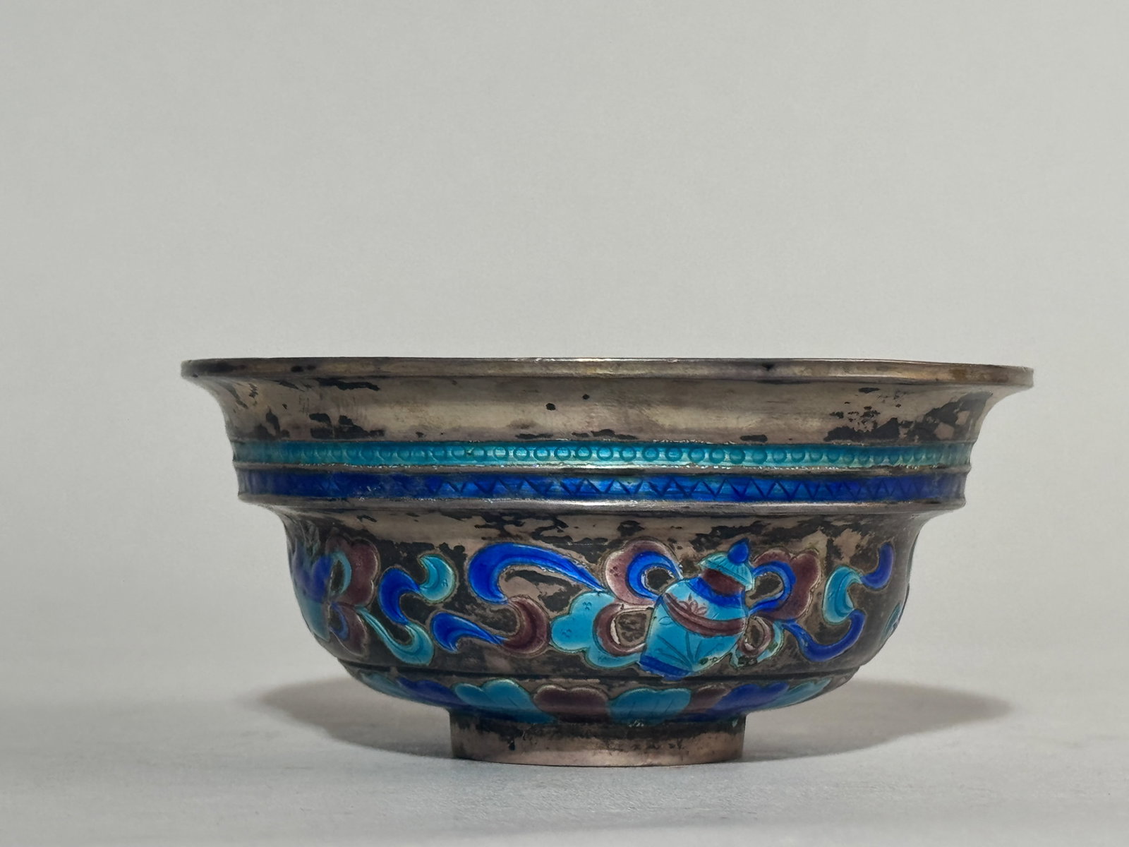 CHINESE ENAMEL ON SILVER BUDDHIST BOWL: A Chinese silver bowl with enamel. Weighs 185 grams (5.95 ozt). Dimensions: Diameter: 4 in. (10.2 cm); Height: 1.7 in. (4.3 cm). Note: This item is in New York, where it can be shipped from.